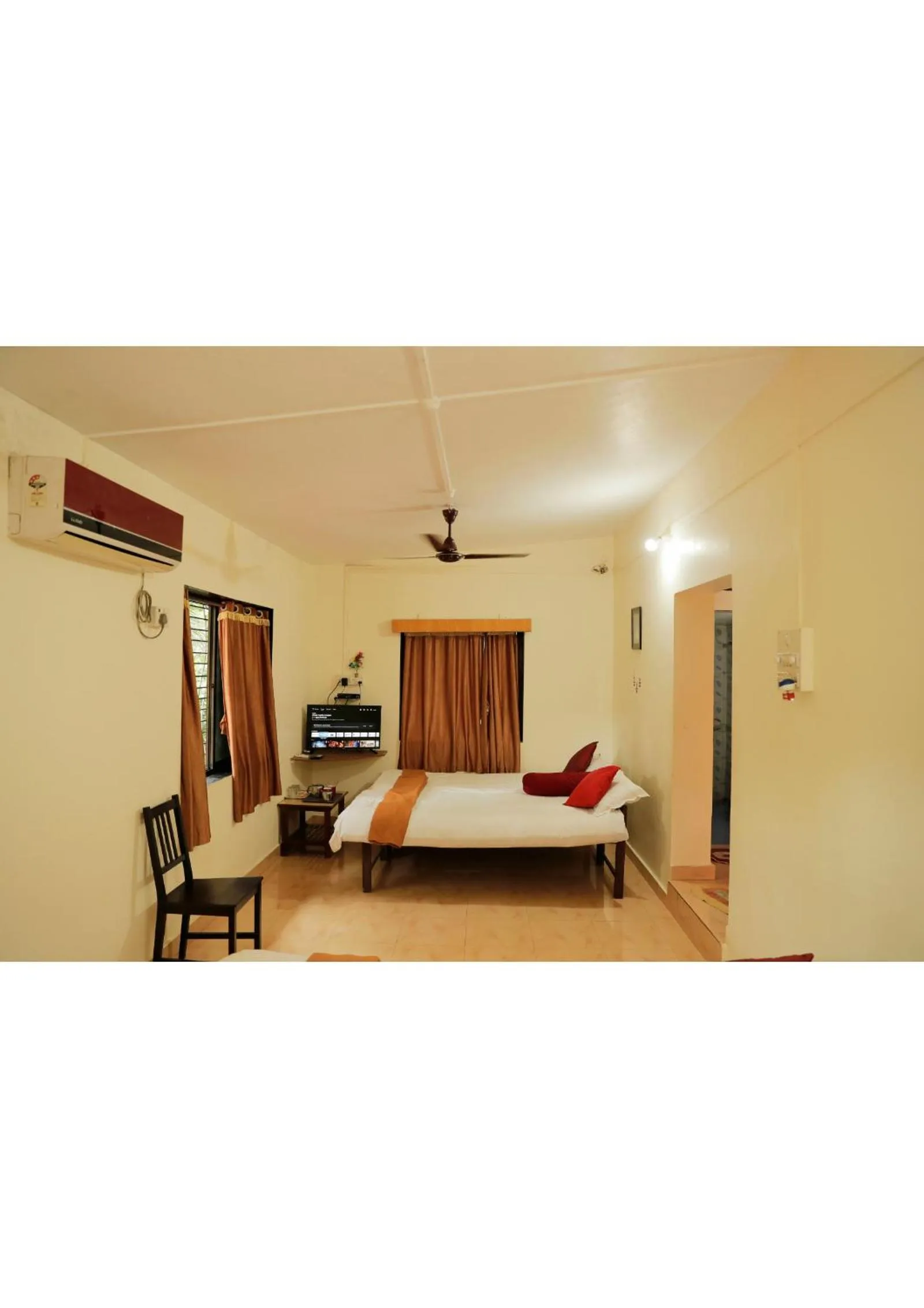 Bed in Nisarg Resort