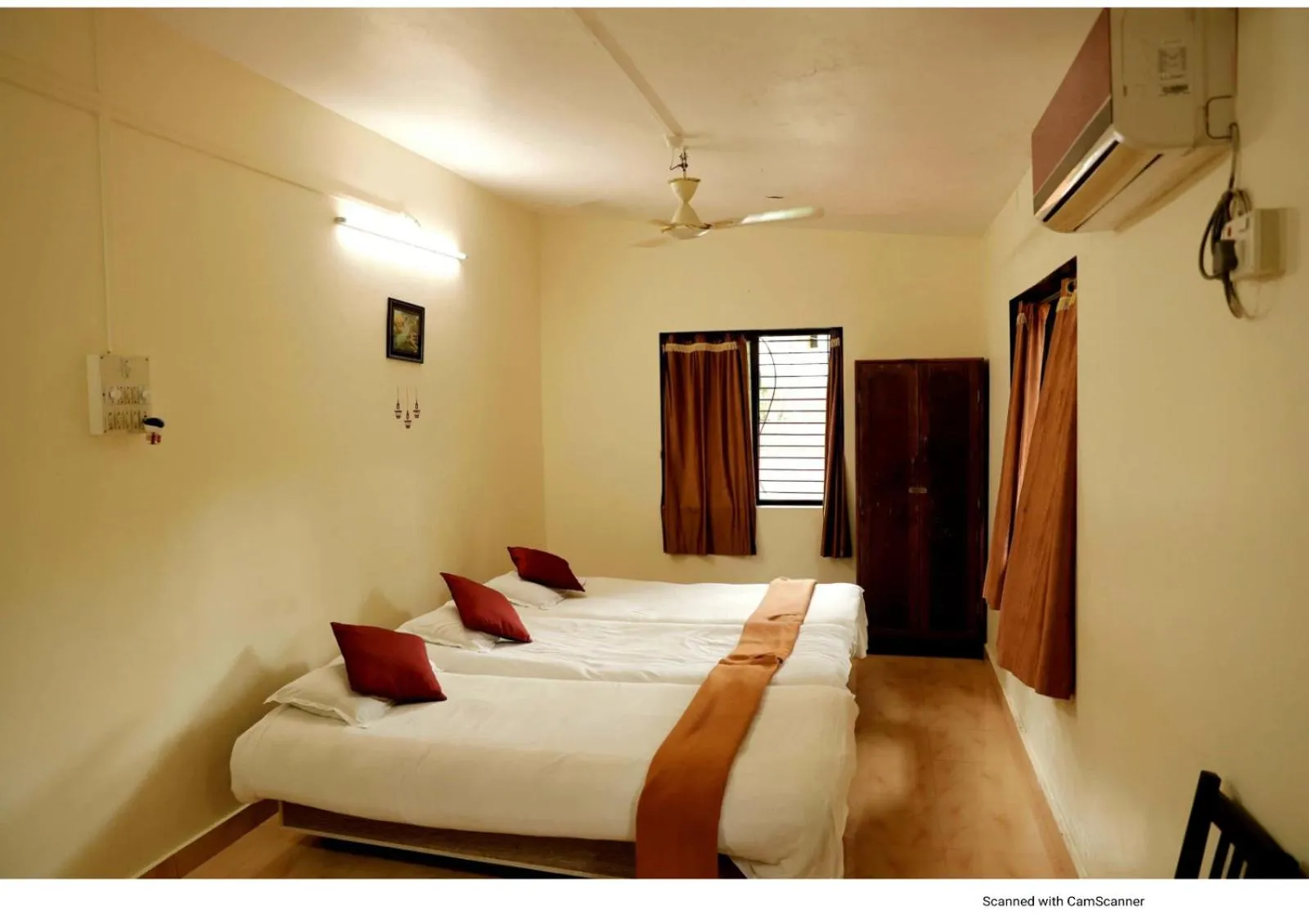 Bed in Nisarg Resort