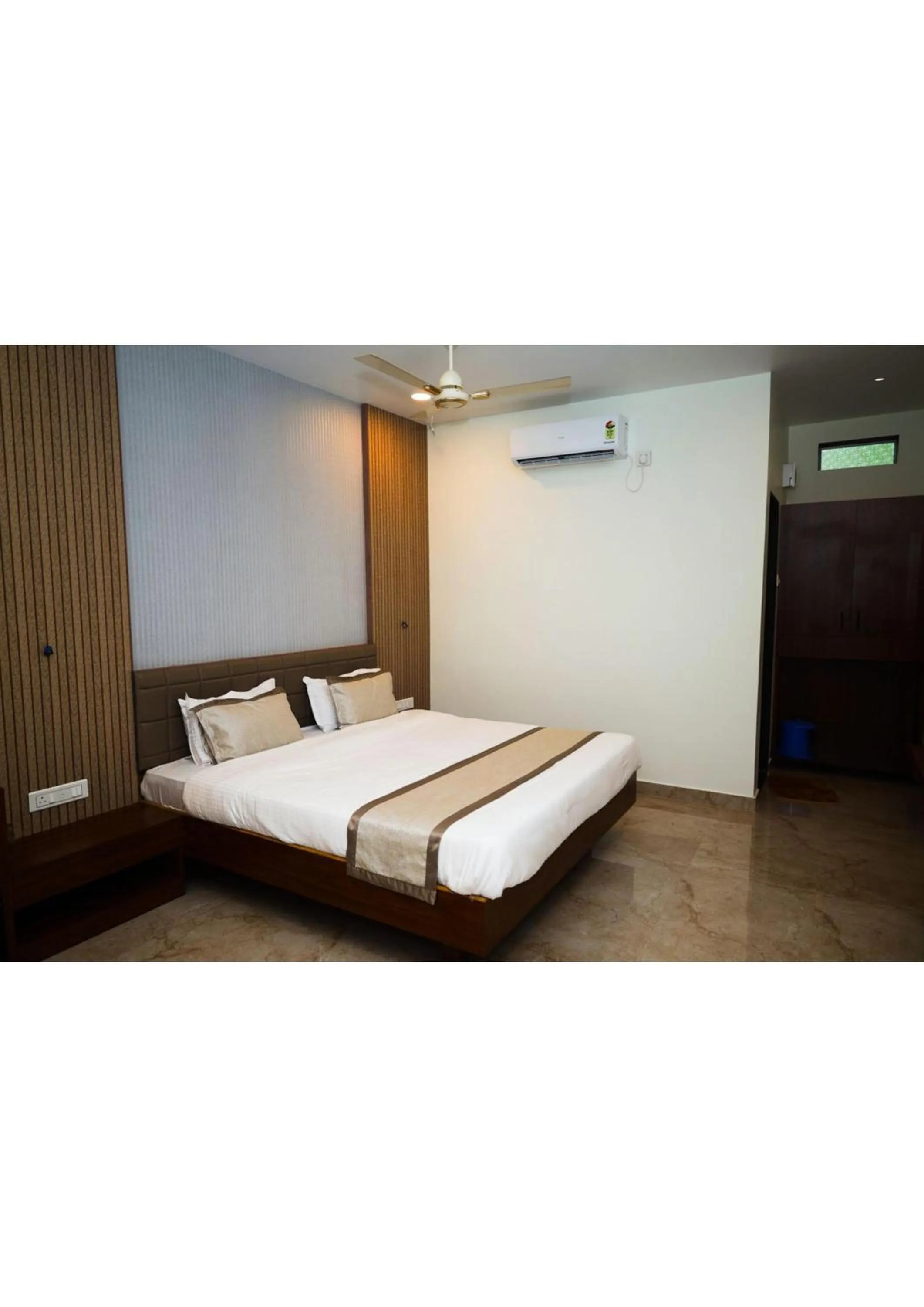 Bed in Nisarg Resort