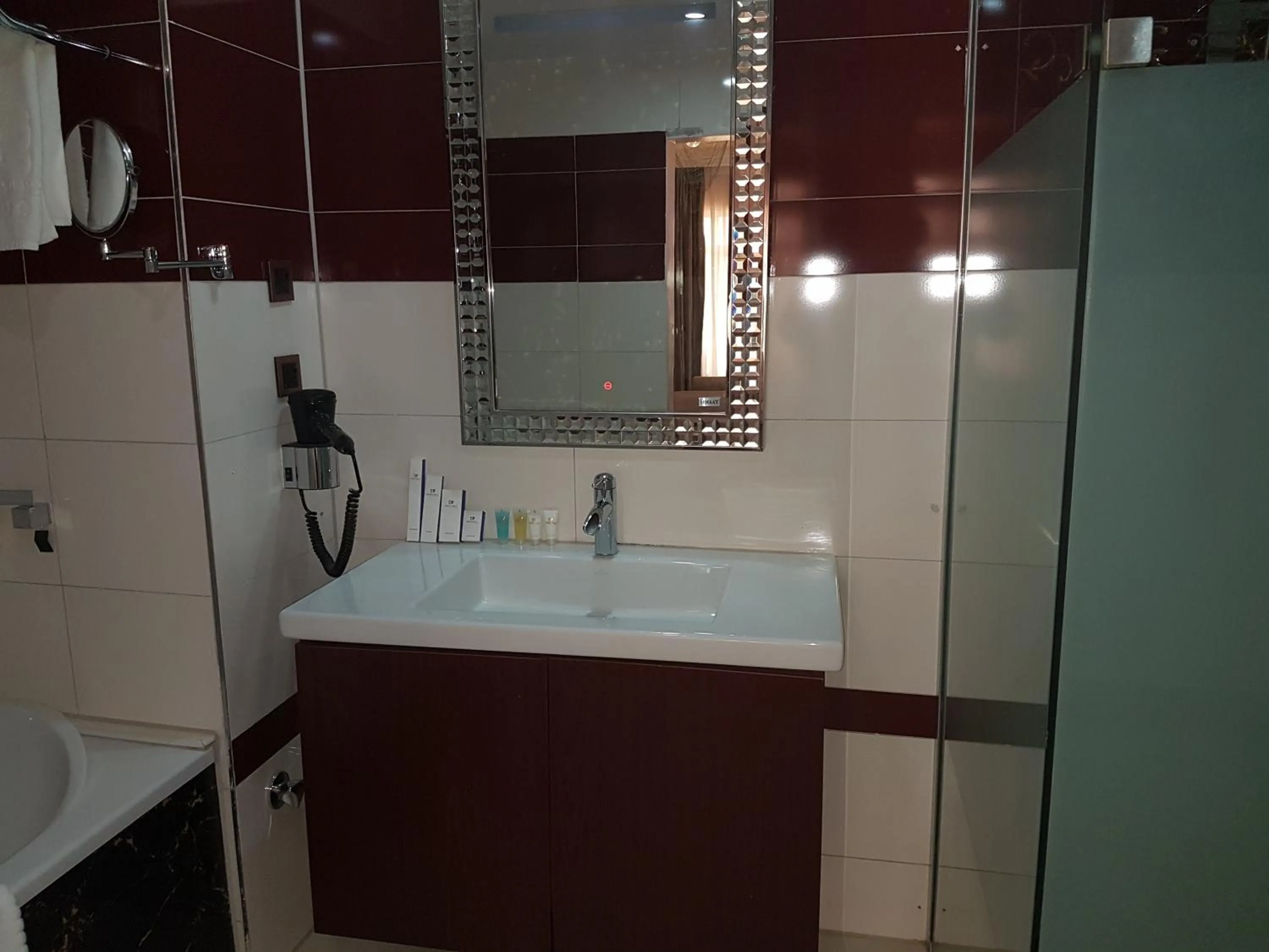 Bathroom in Grand Pela Hotel & Suites