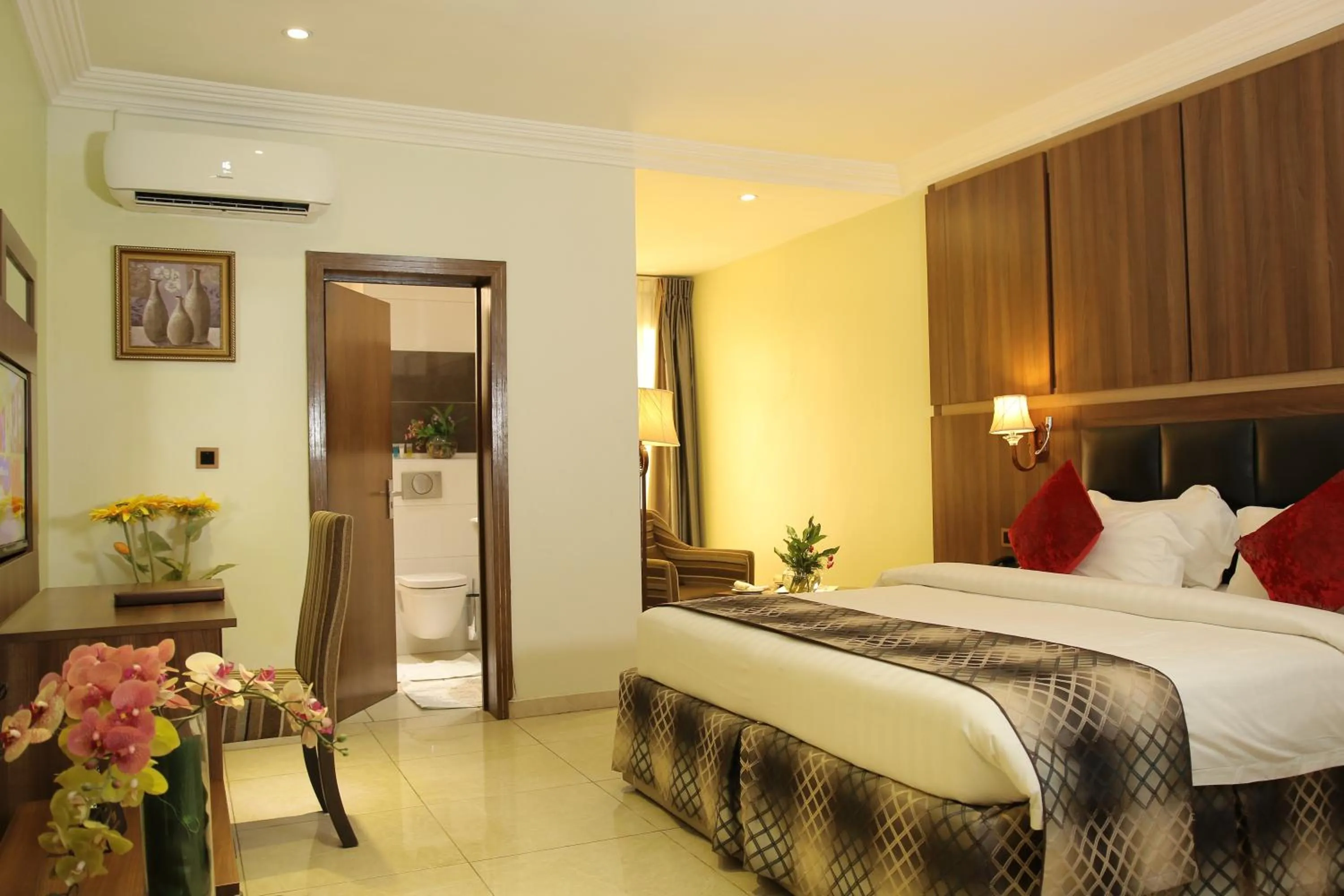 Bed in Grand Pela Hotel & Suites
