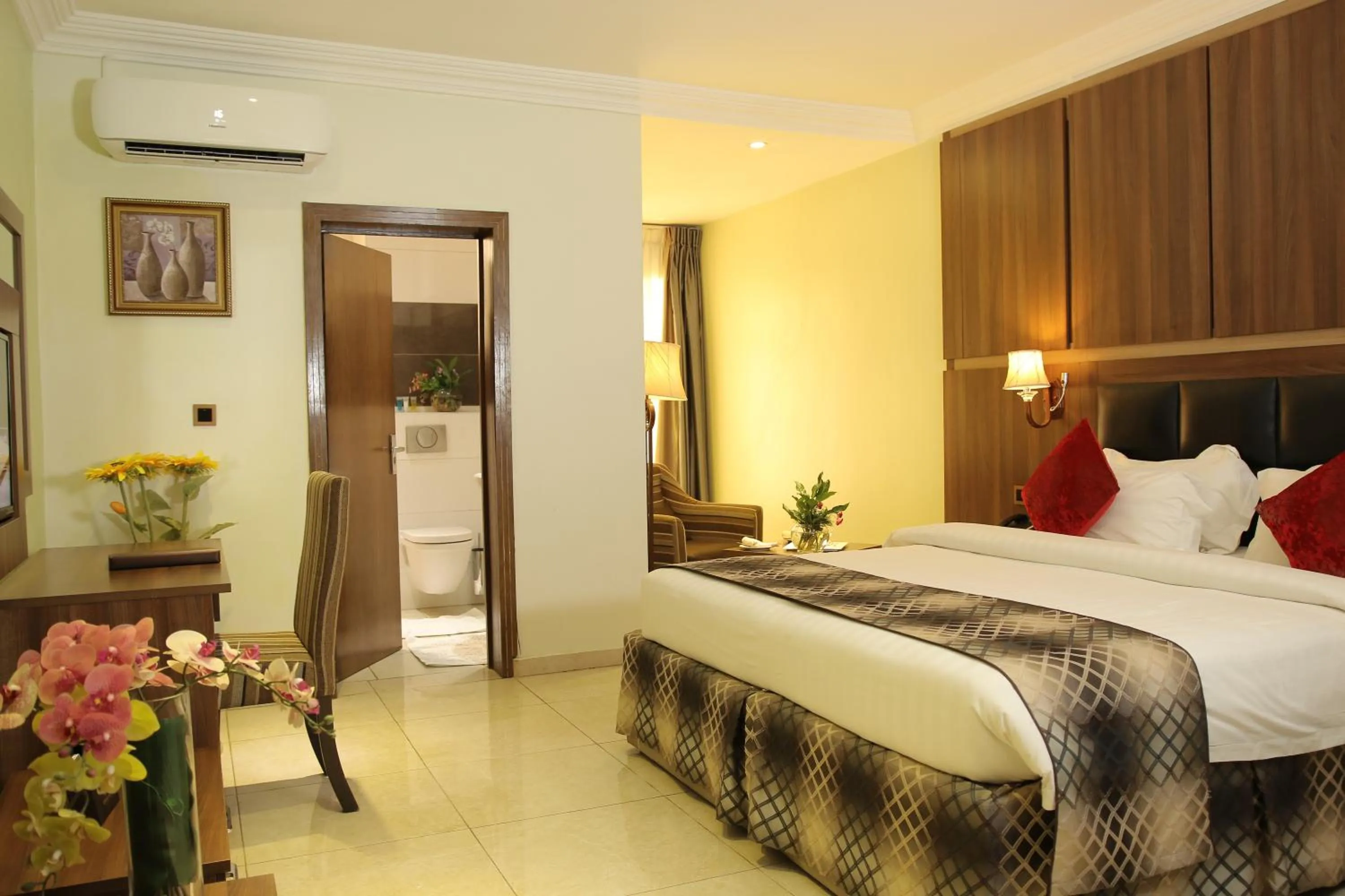 Bed in Grand Pela Hotel & Suites