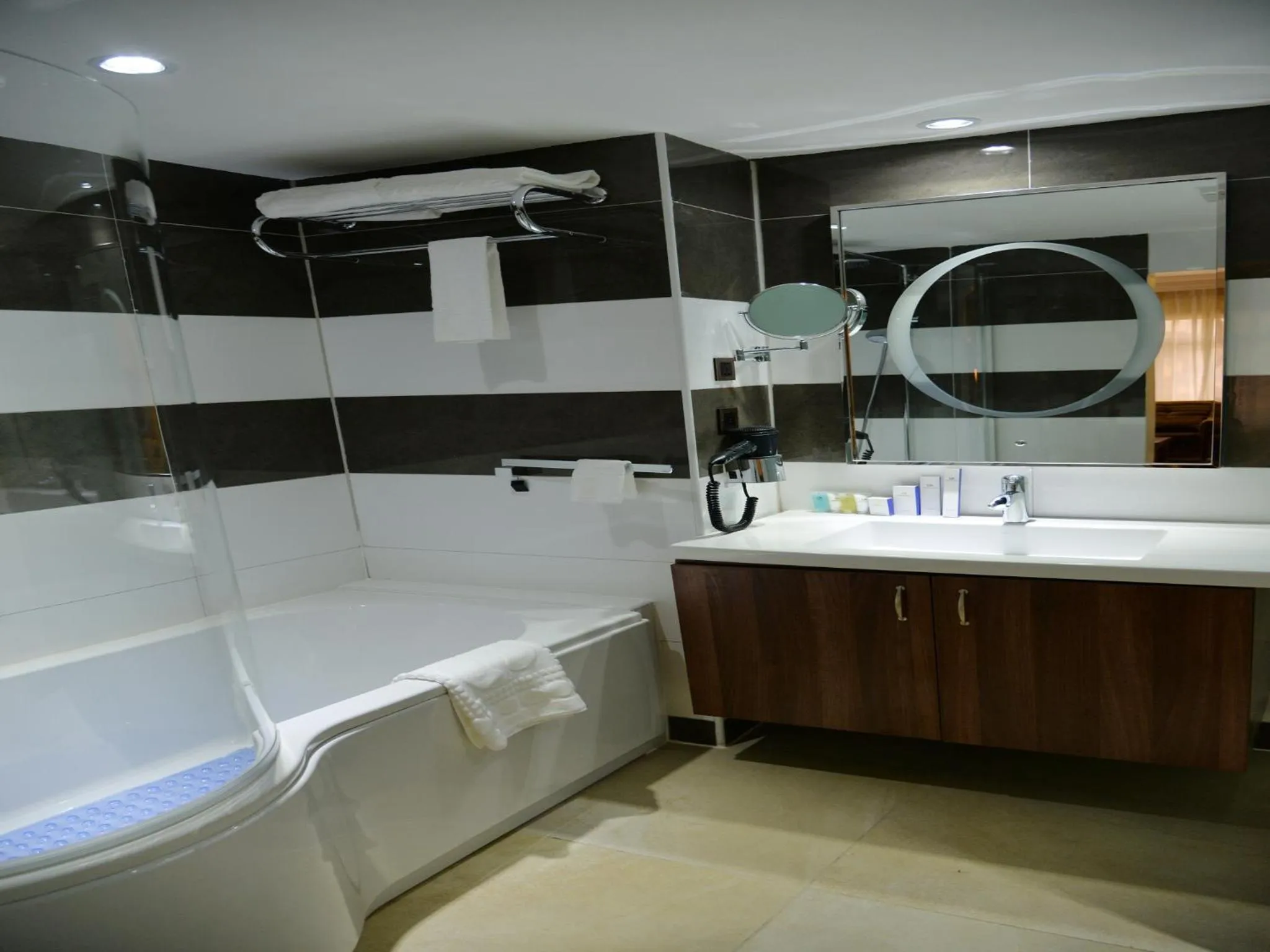 Shower in Grand Pela Hotel & Suites