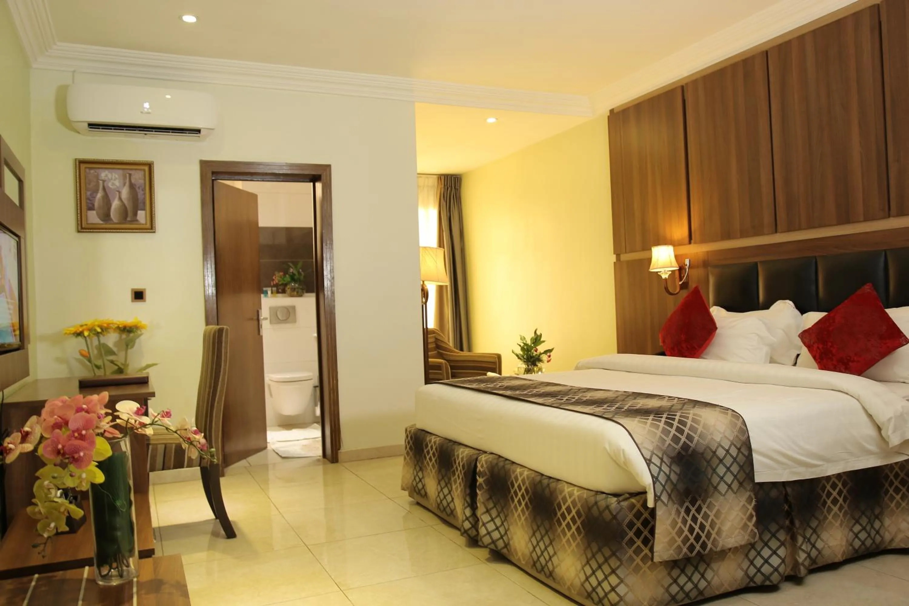 Bed in Grand Pela Hotel & Suites