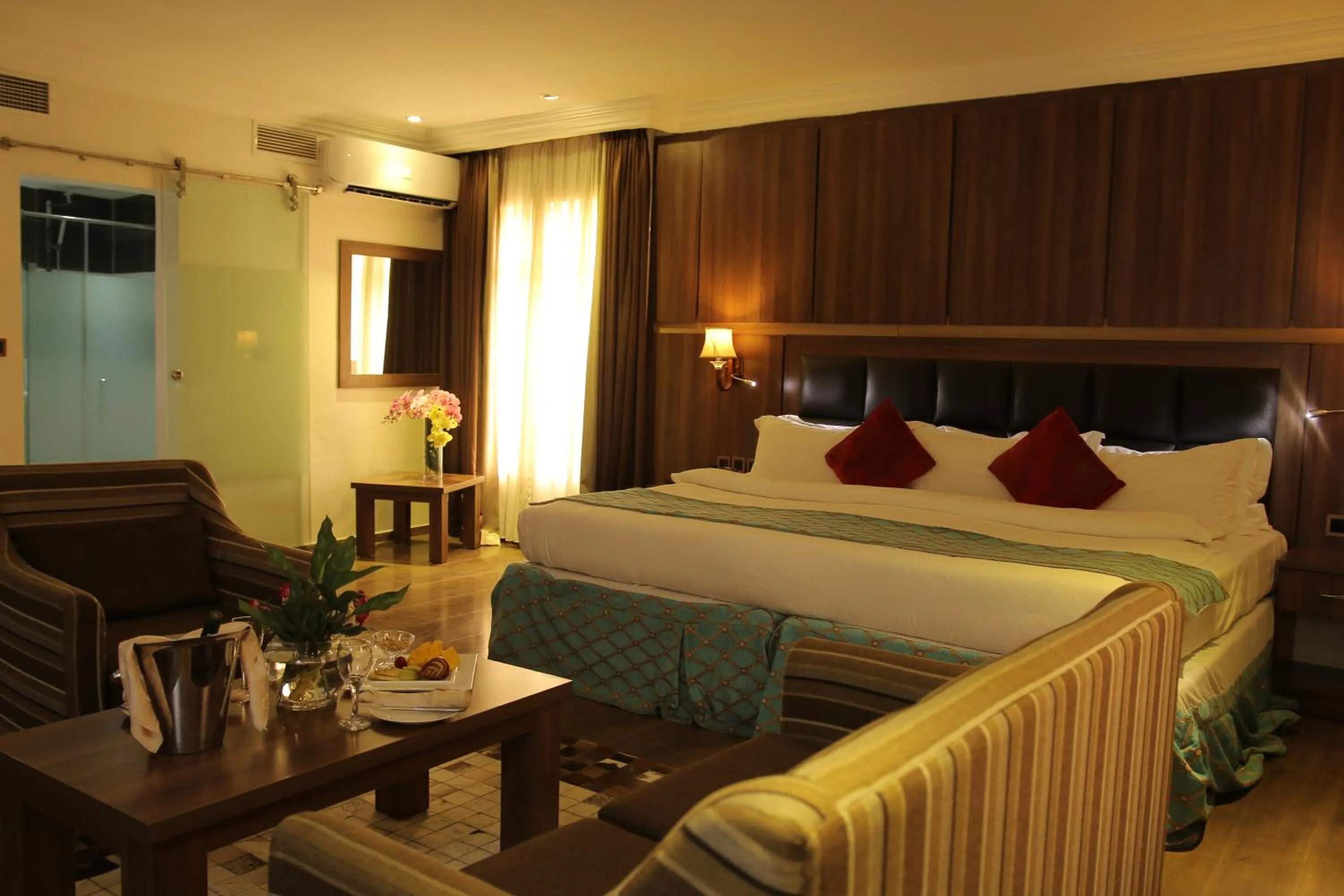 Bed in Grand Pela Hotel & Suites