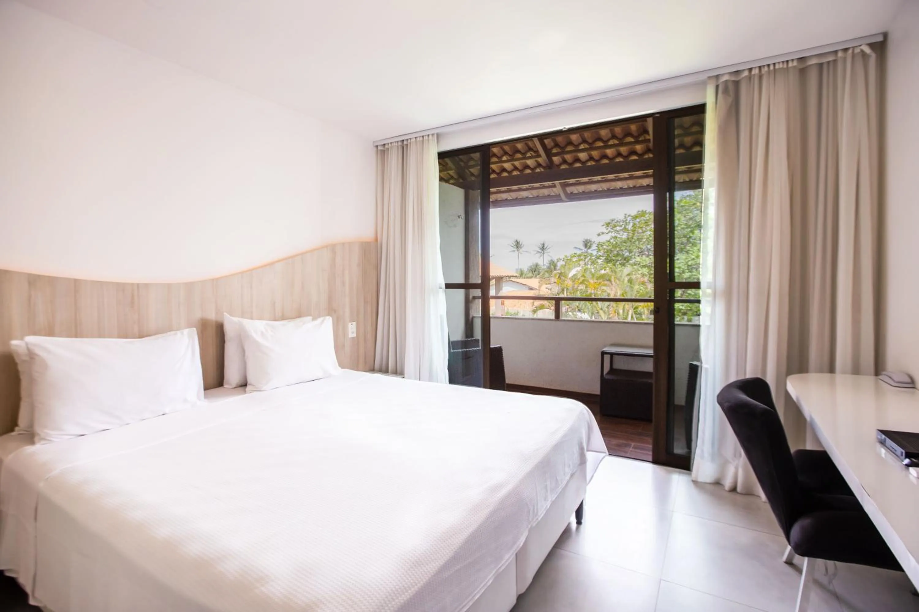 Bed in Duro Beach Garden Hotel