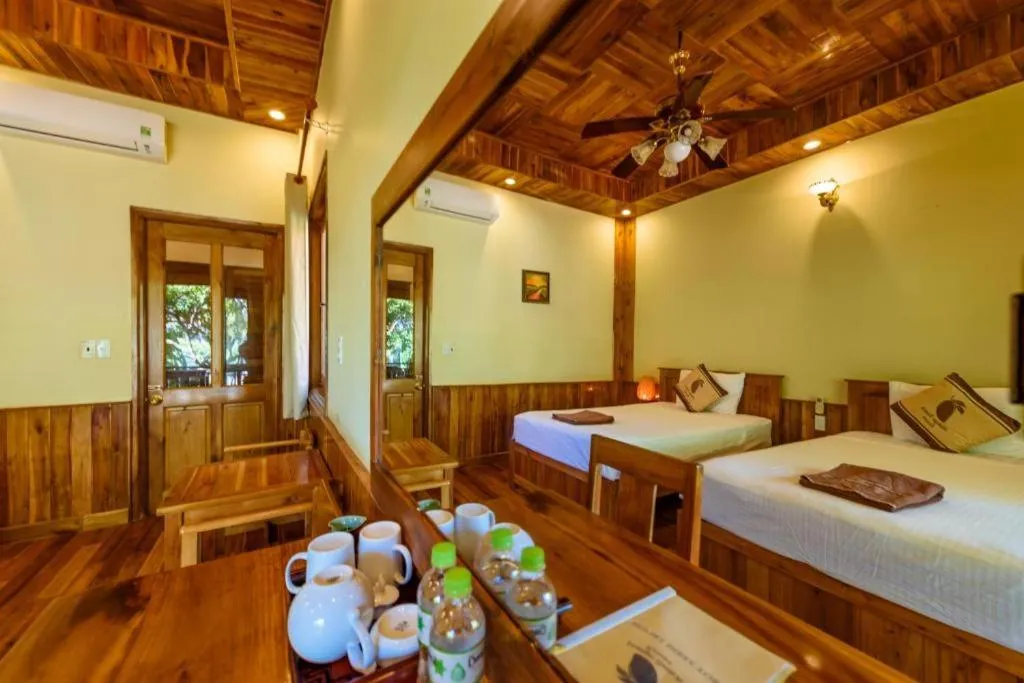 Bed in Mango Beach Resort