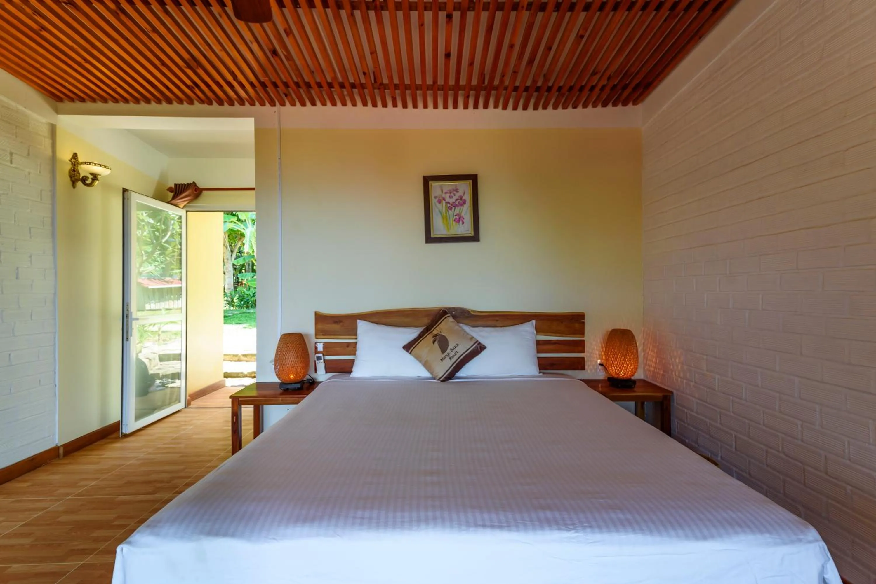 Bed in Mango Beach Resort
