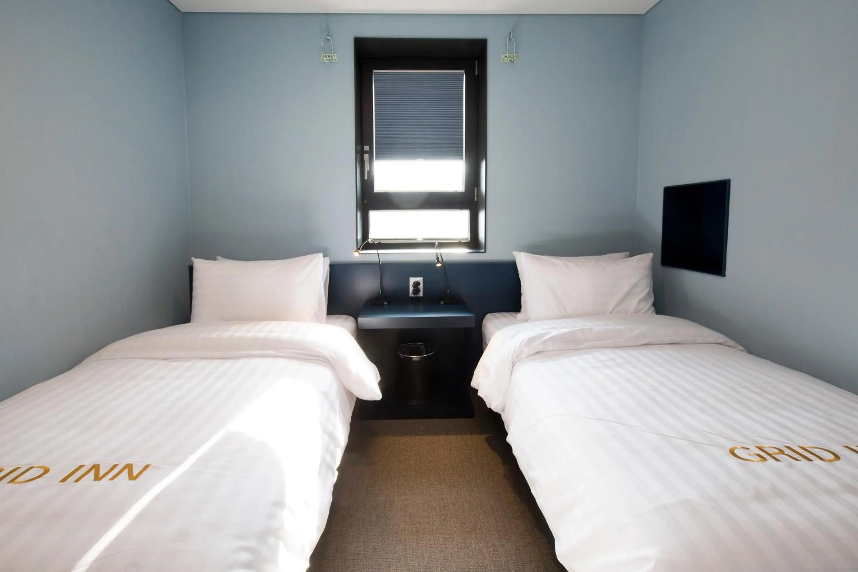 Decorative detail, Bed in Grid Inn Hotel