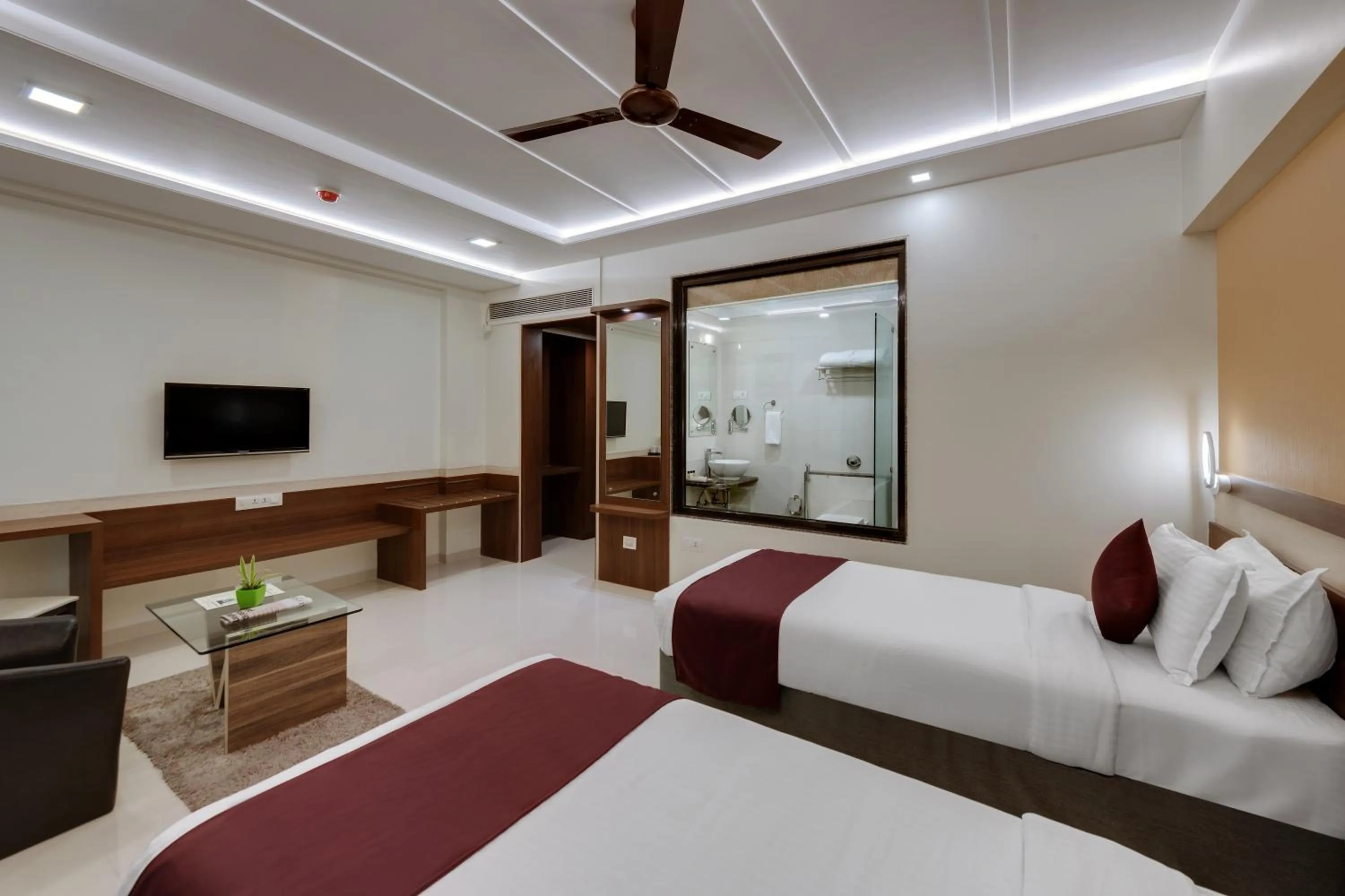 Photo of the whole room, Bed in Click Hotel Sagar Plaza Chakan, Pune