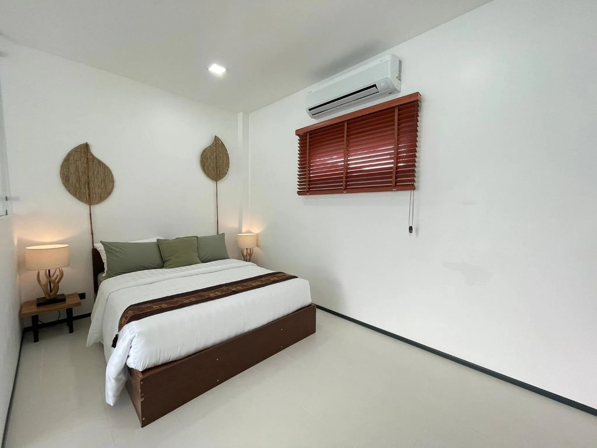 Bed in Lotus Bleu Resort & Restaurant