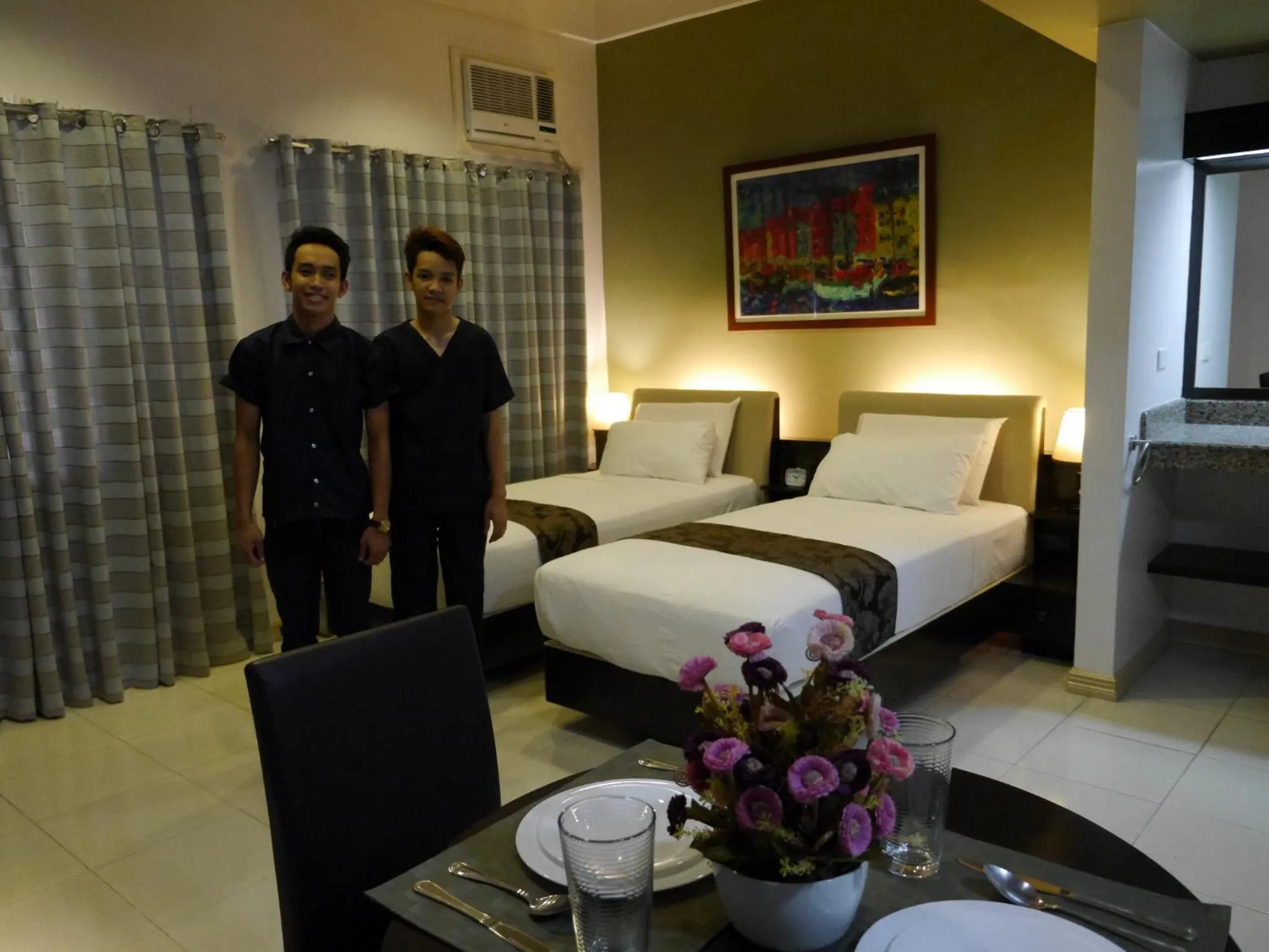 Staff, Bed in New Manila Suites