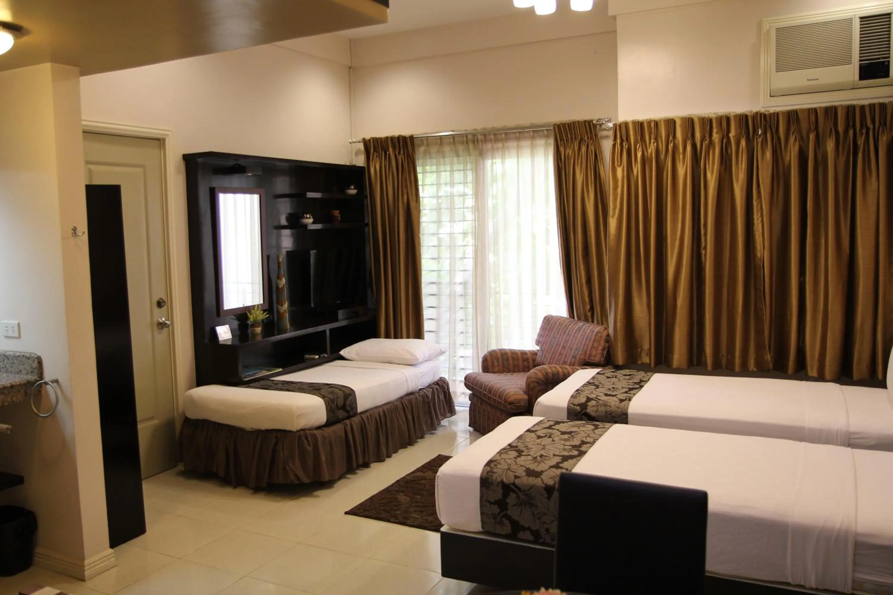 Bed in New Manila Suites