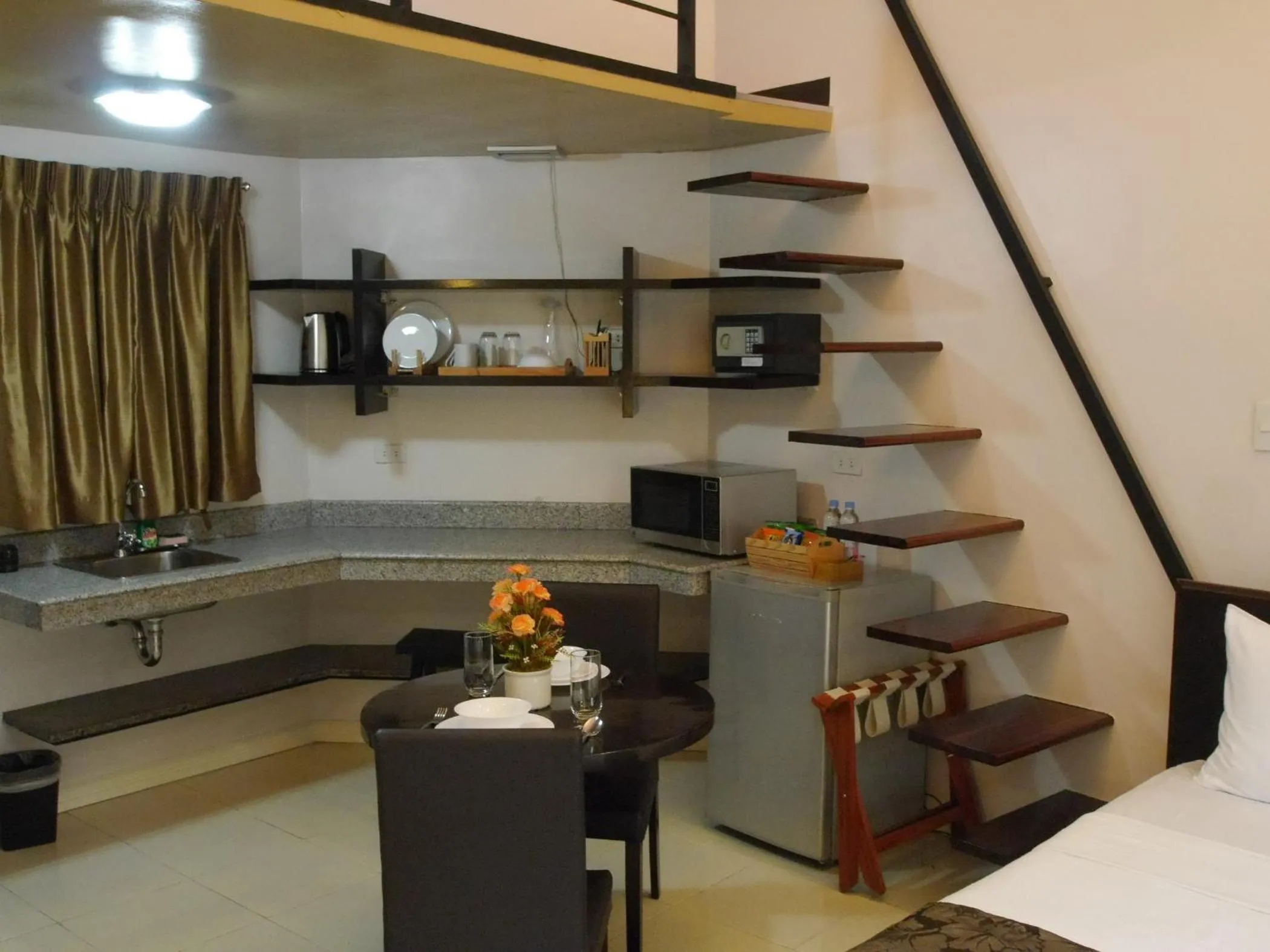 Kitchen or kitchenette in New Manila Suites