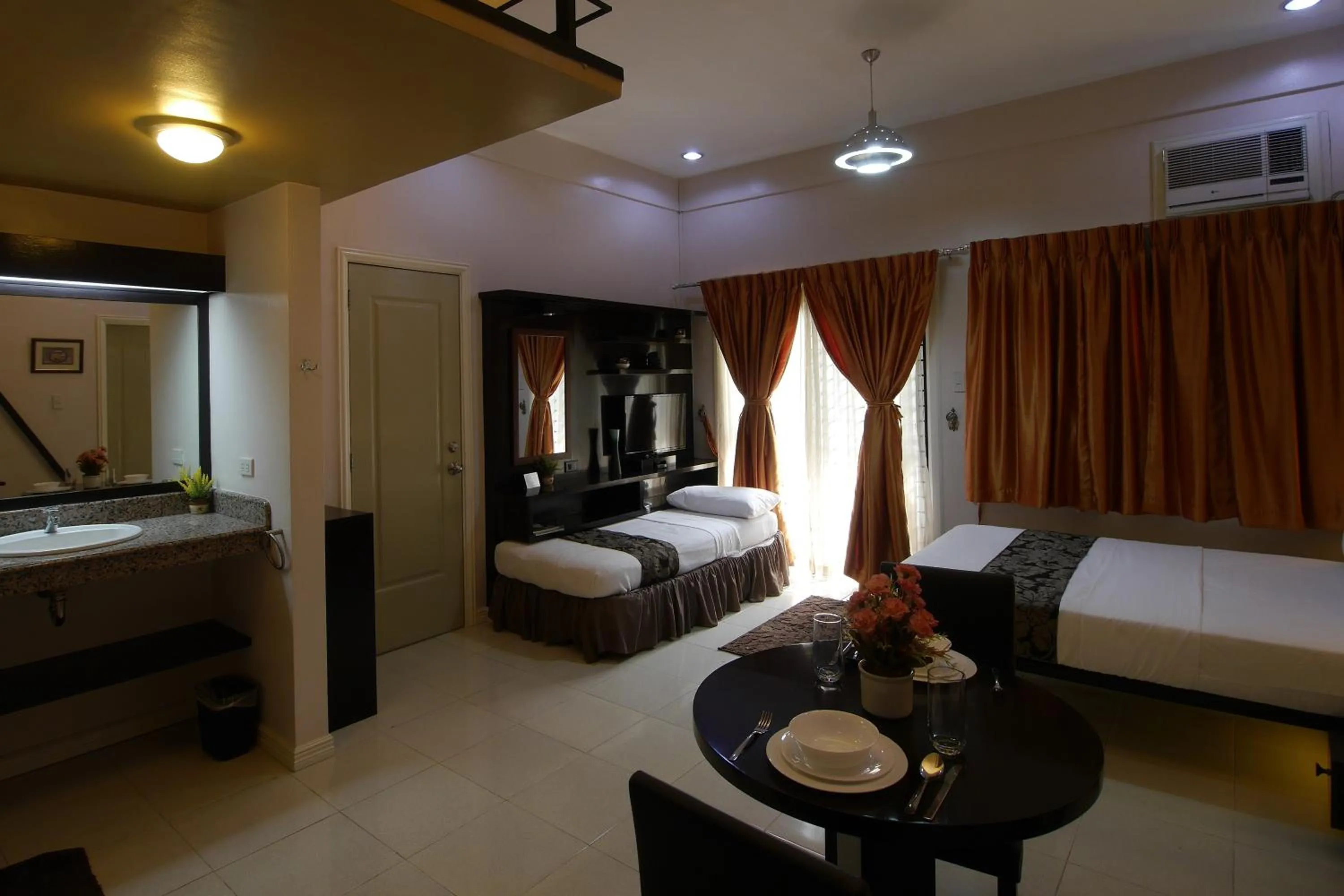 Bed in New Manila Suites