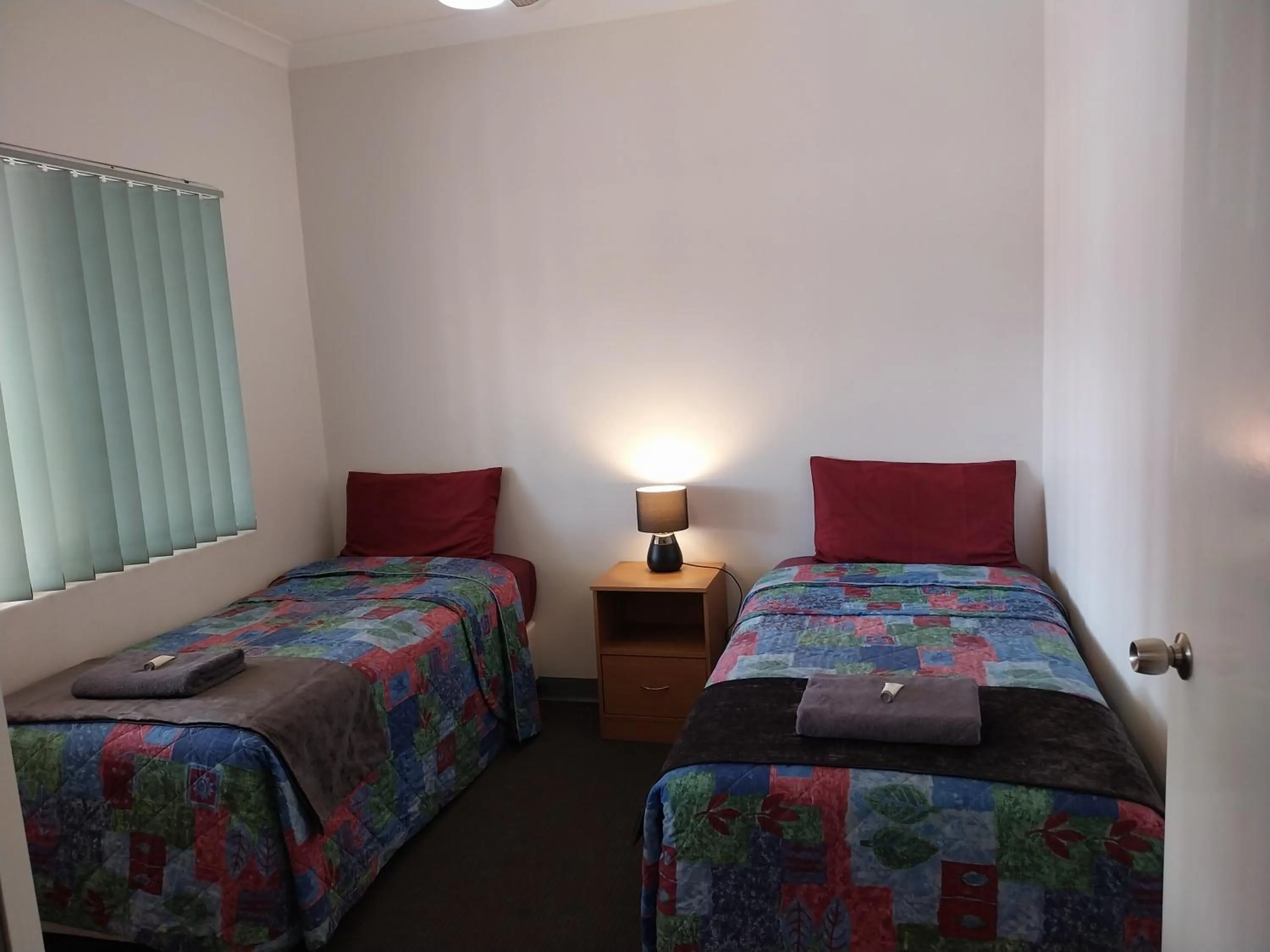 Bed in Carnarvon Central Apartments
