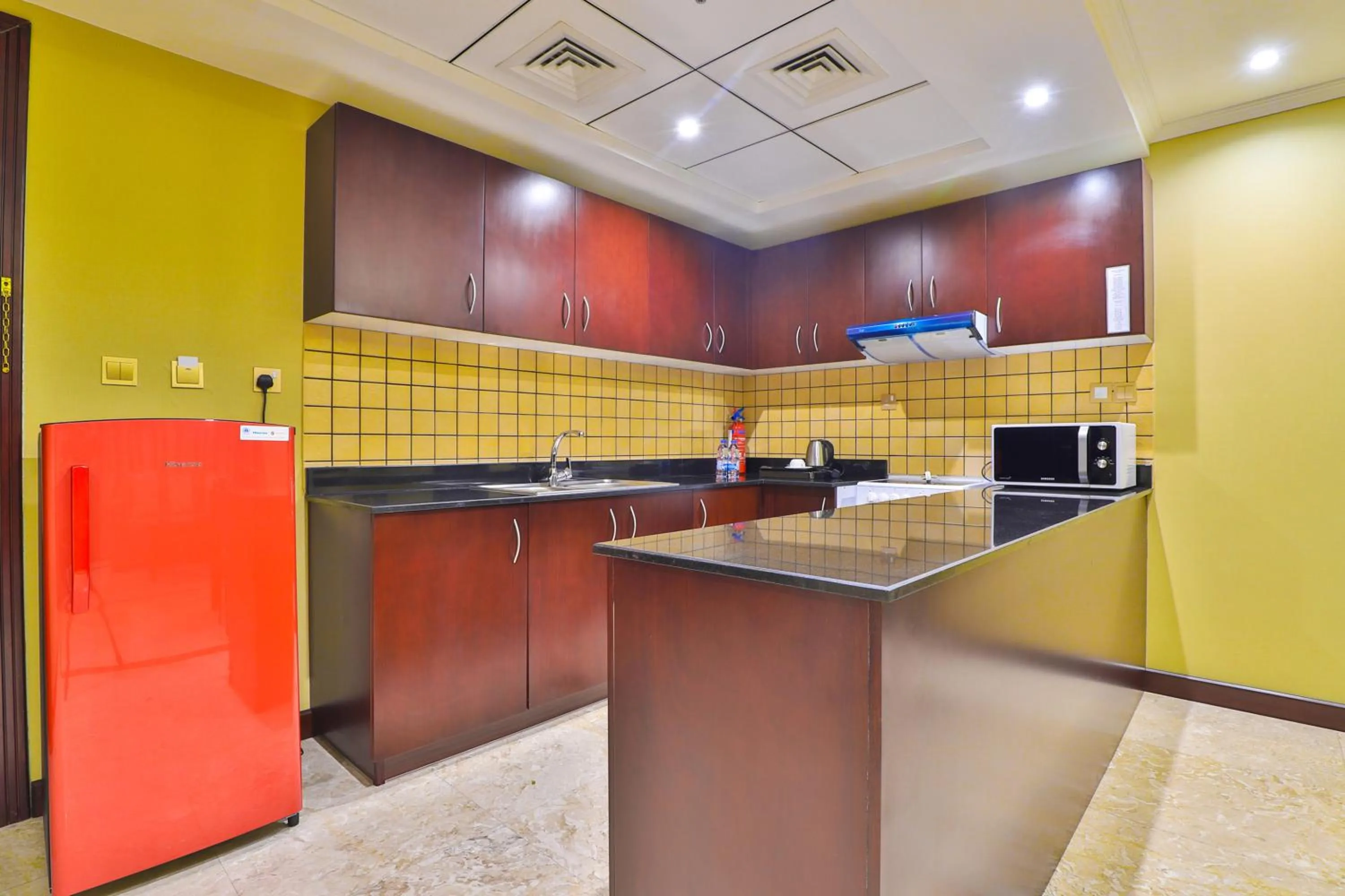 Kitchen or kitchenette in Telal Hotel Apartments
