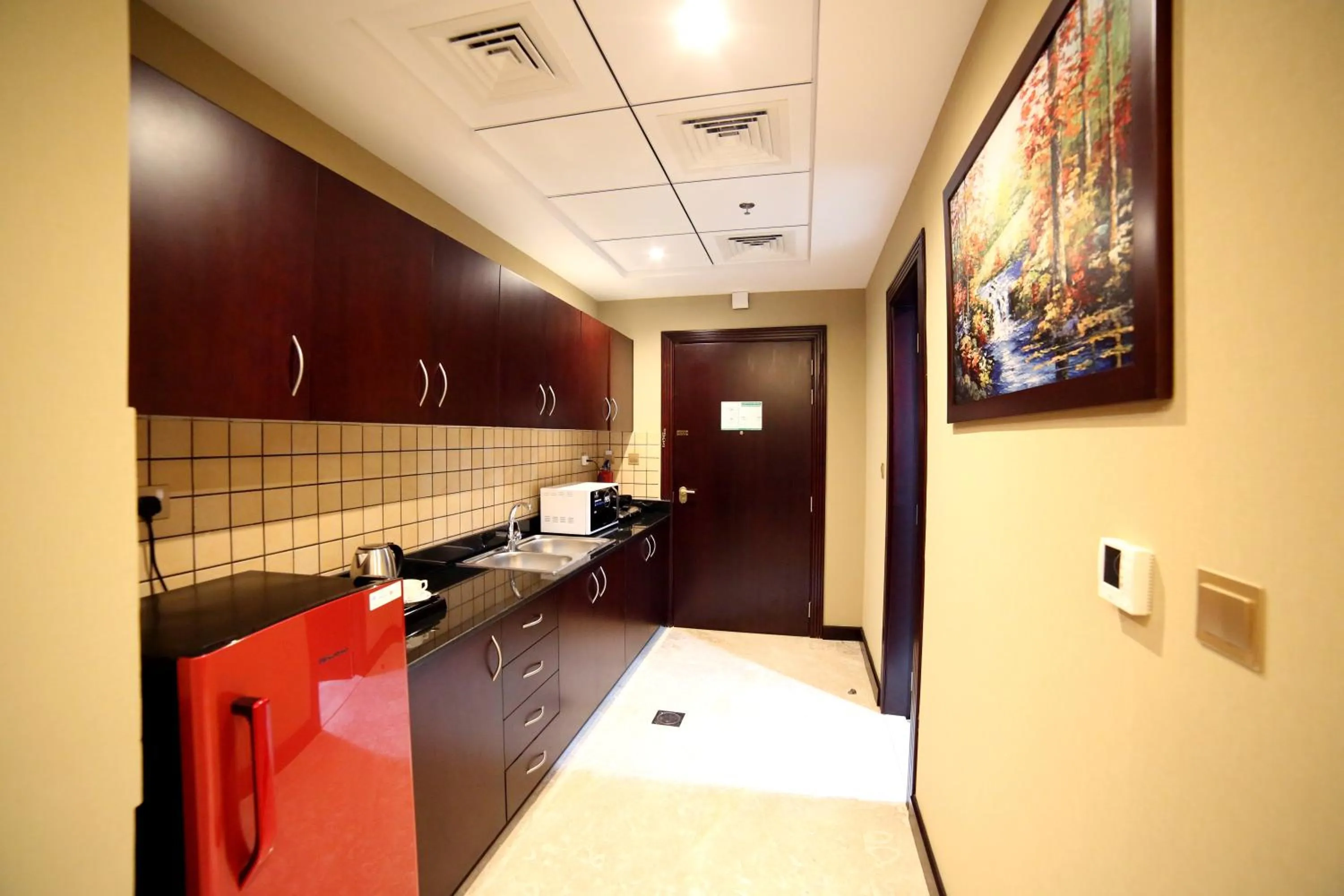 Kitchen or kitchenette in Telal Hotel Apartments