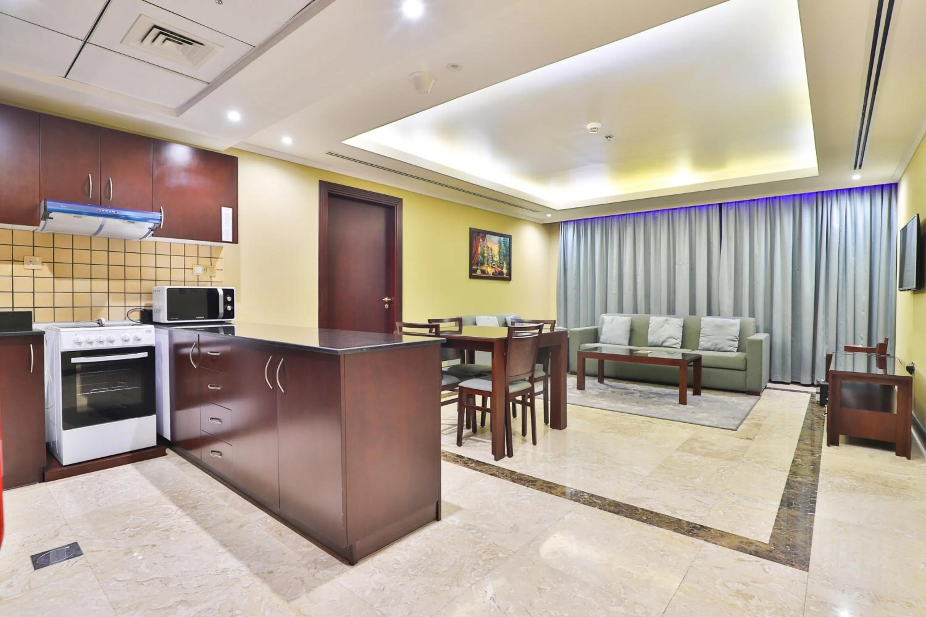 Kitchen or kitchenette in Telal Hotel Apartments