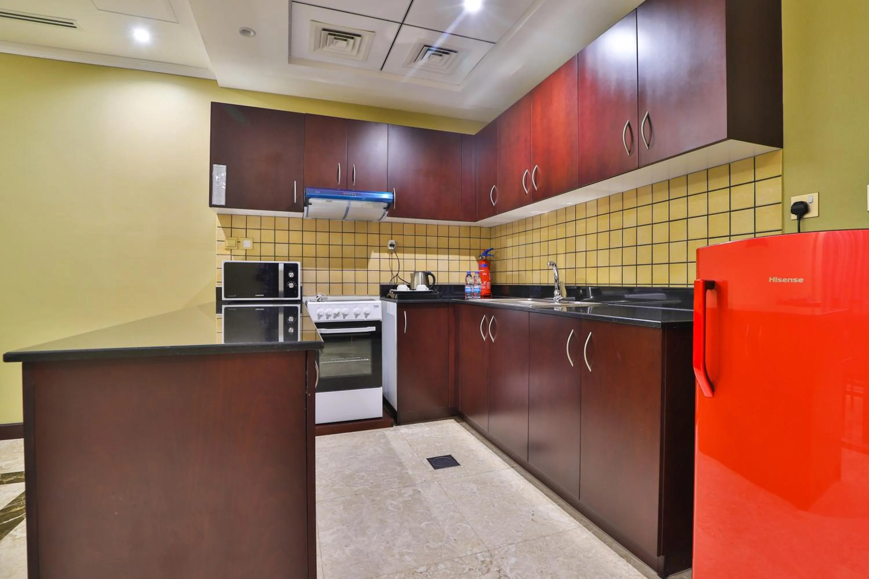 Kitchen or kitchenette in Telal Hotel Apartments