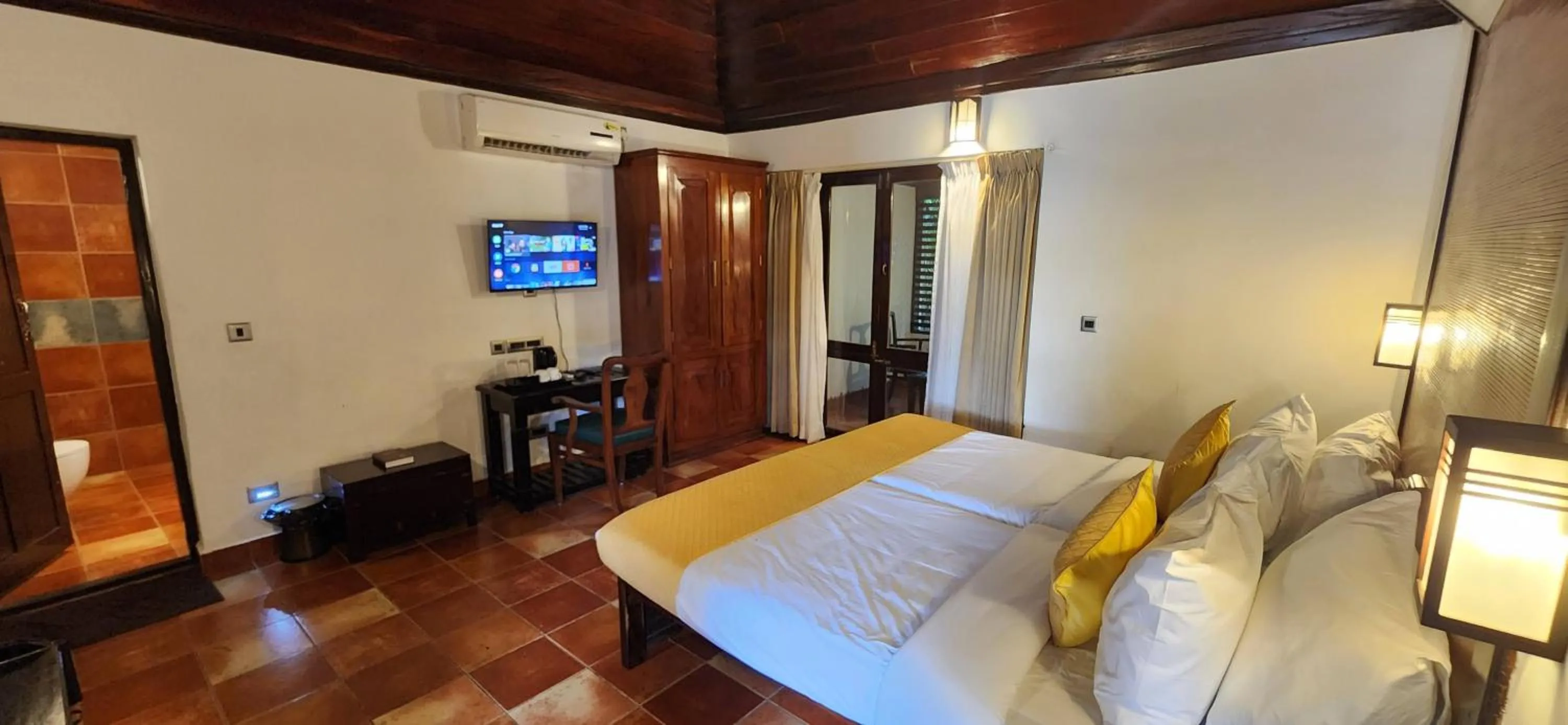 Bedroom, Bed in Kumarakom Tharavadu - A Heritage Hotel, Kumarakom By Perfect Stays