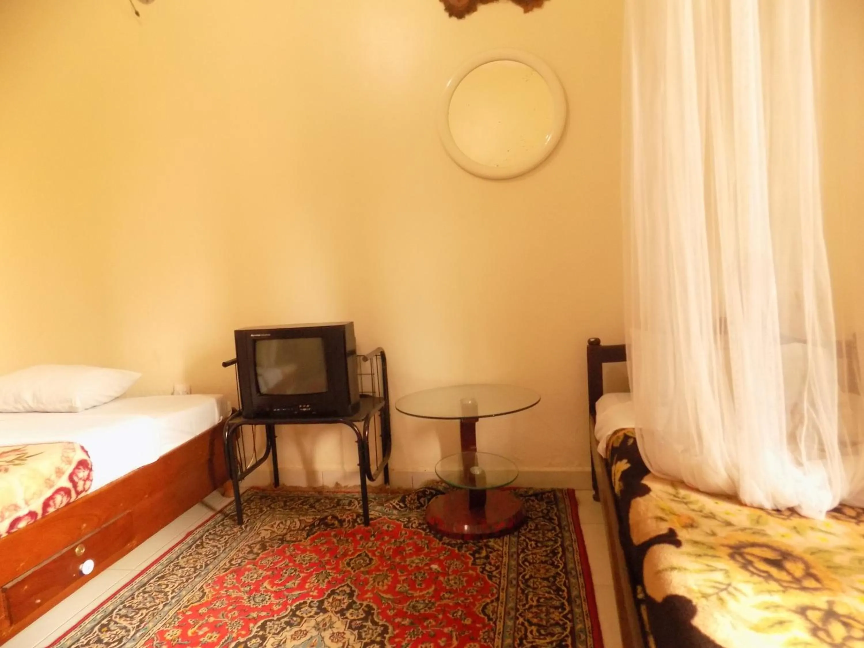 TV and multimedia, Bed in Meliva Guest House Mbarara