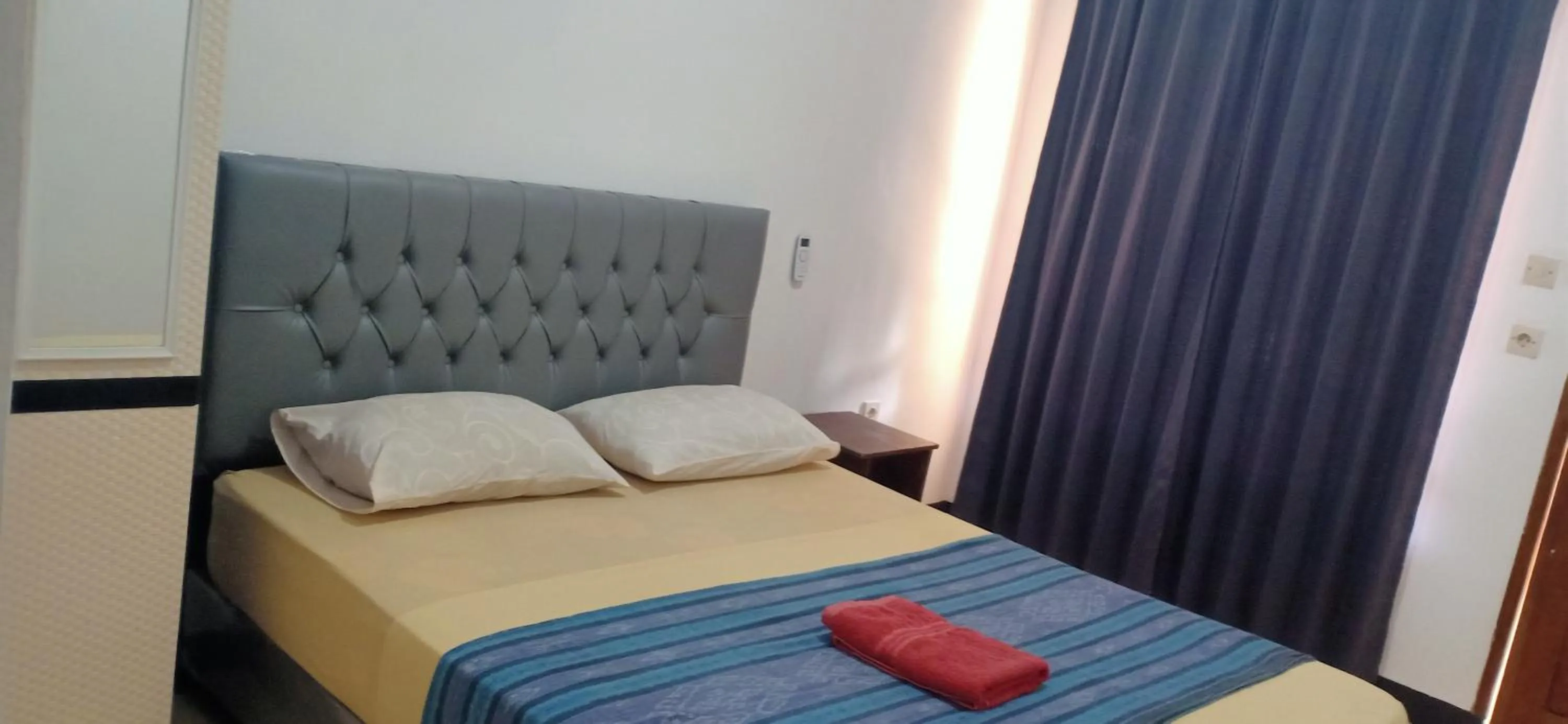 Bed in Dewi Garden Guesthouse