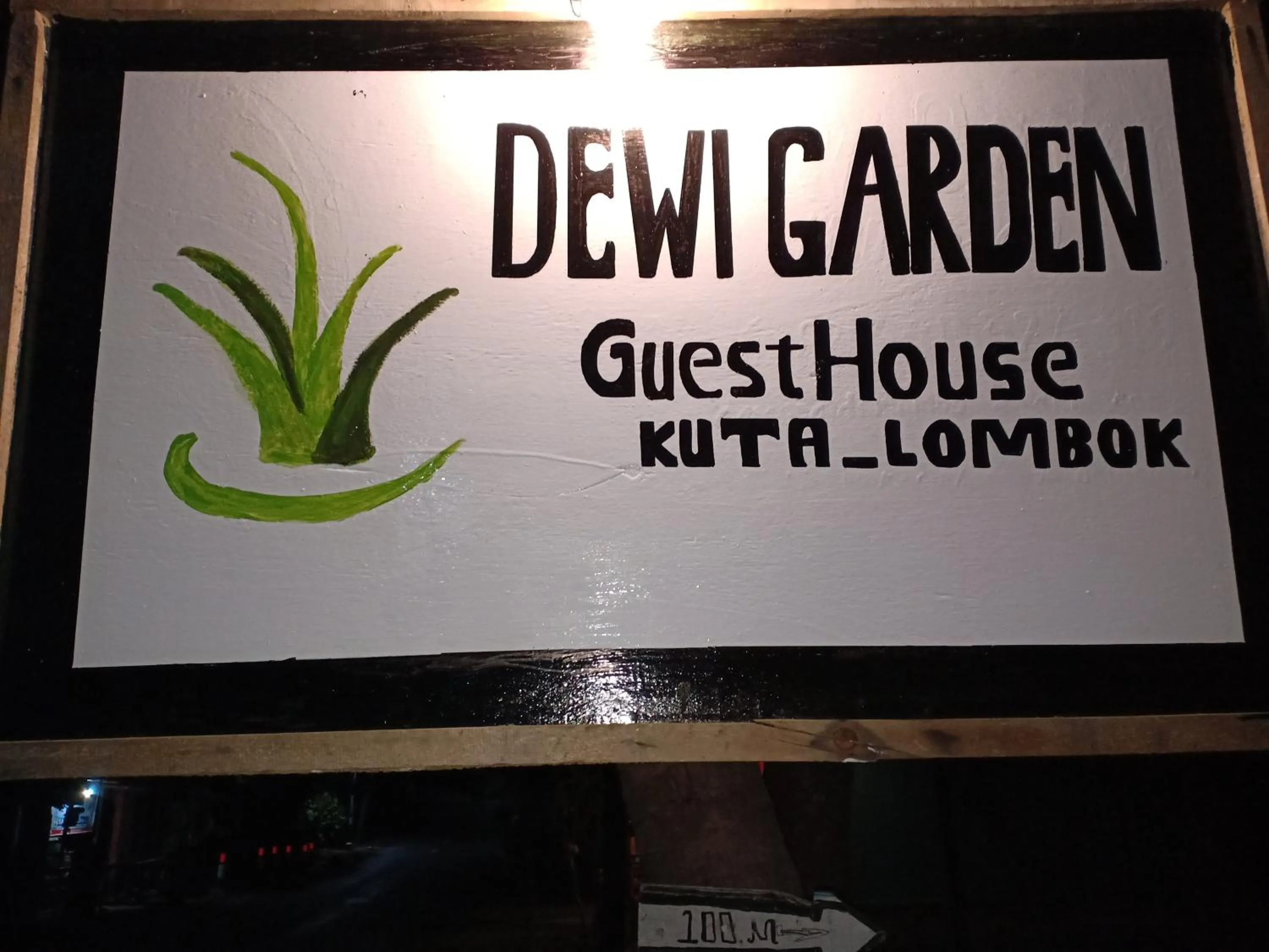 Property logo or sign in Dewi Garden Guesthouse