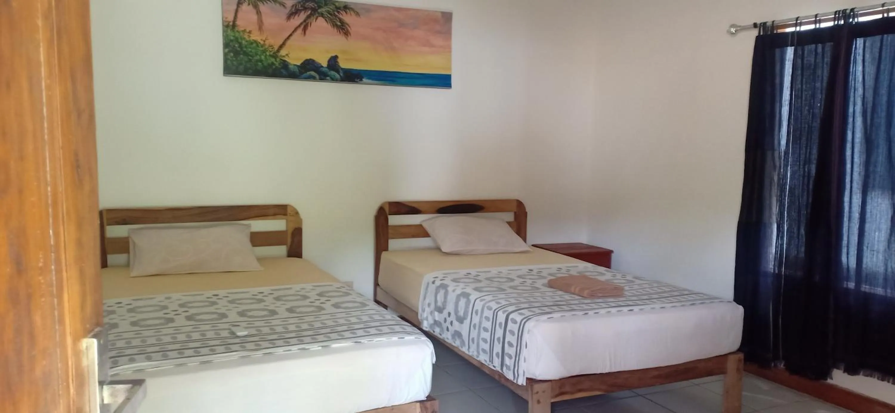 Bed in Dewi Garden Guesthouse