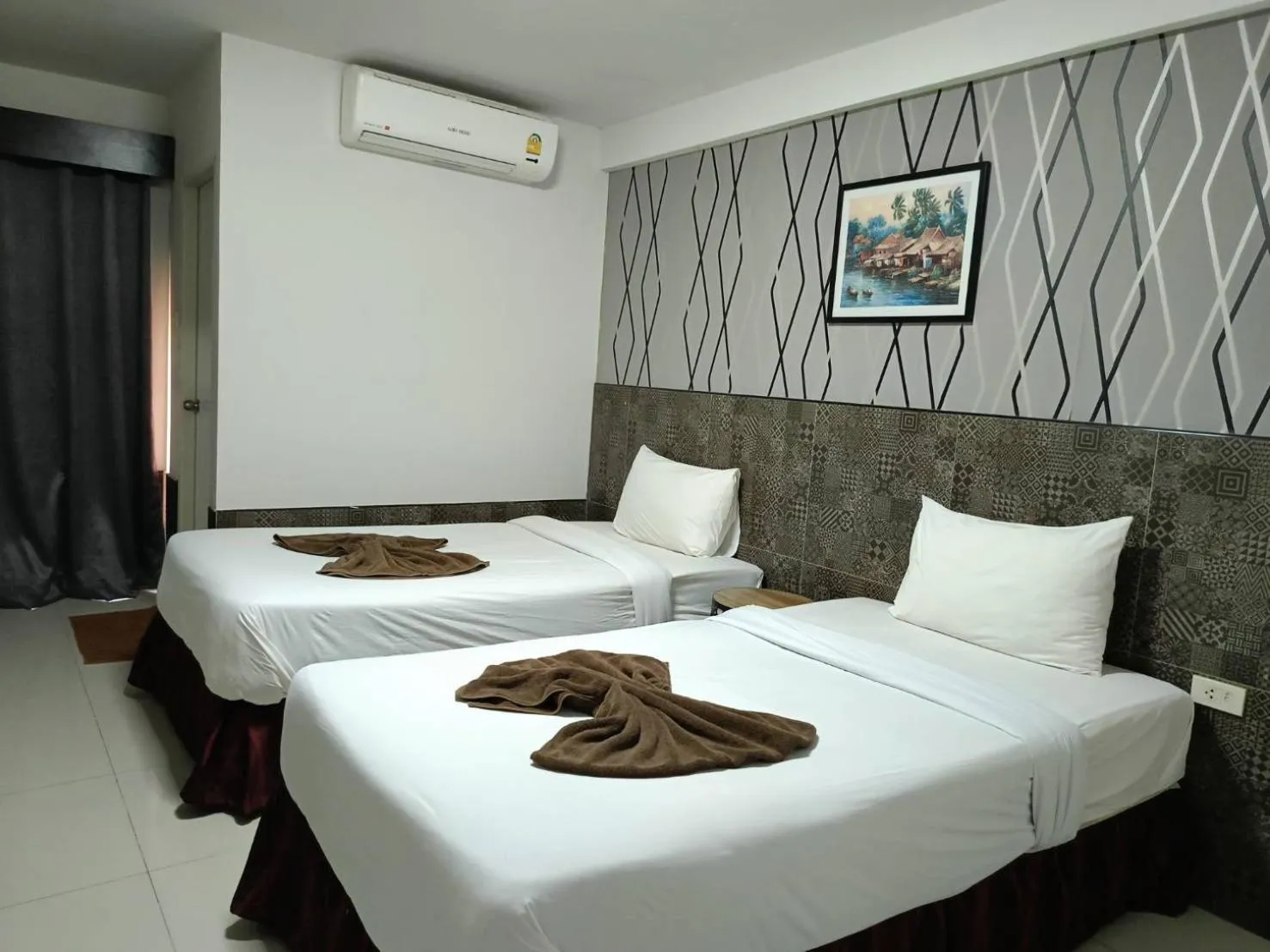 Bed in Grand Pruksa Siri Apartment