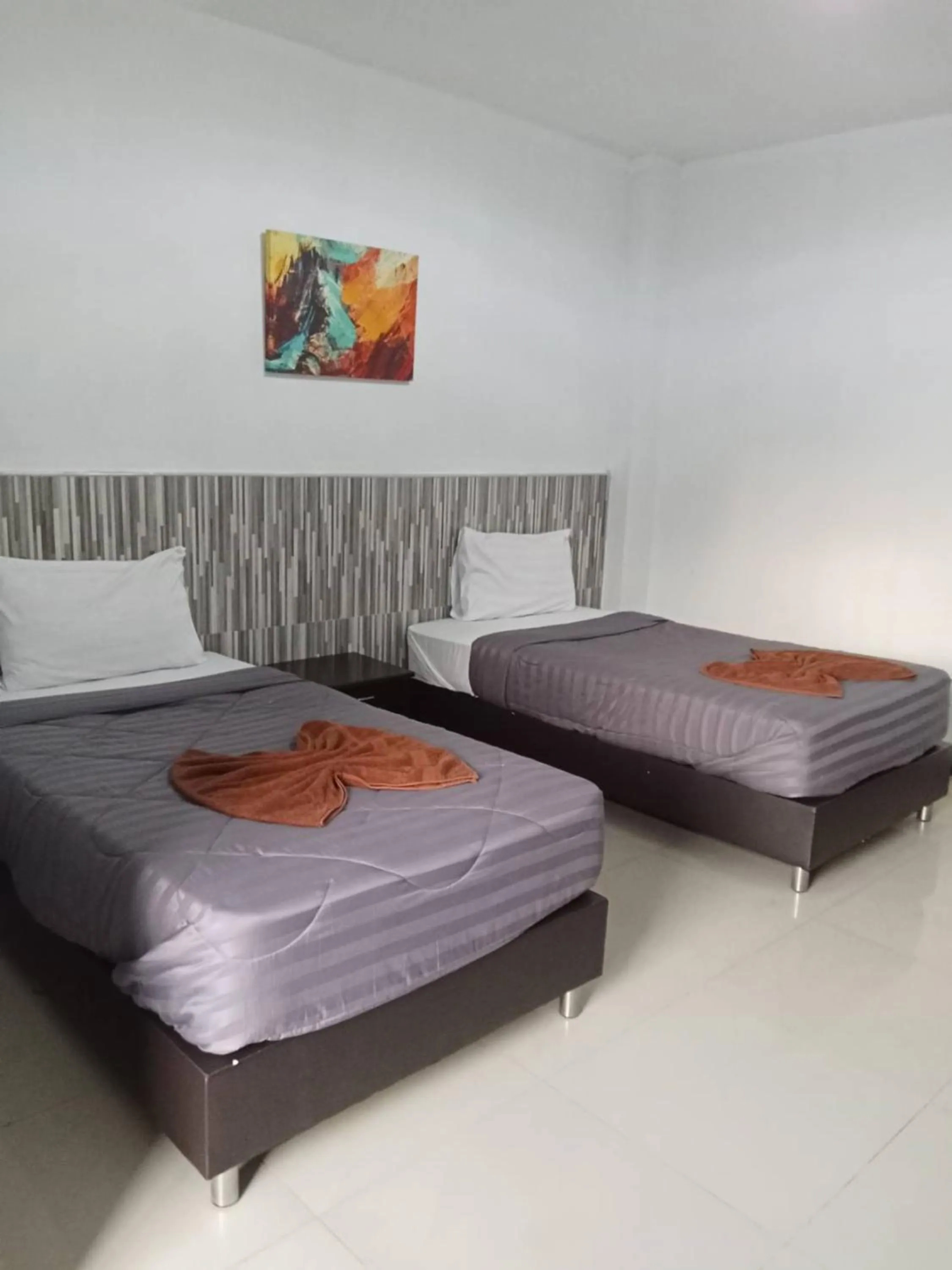 Bed in PS Hotel Saraburi