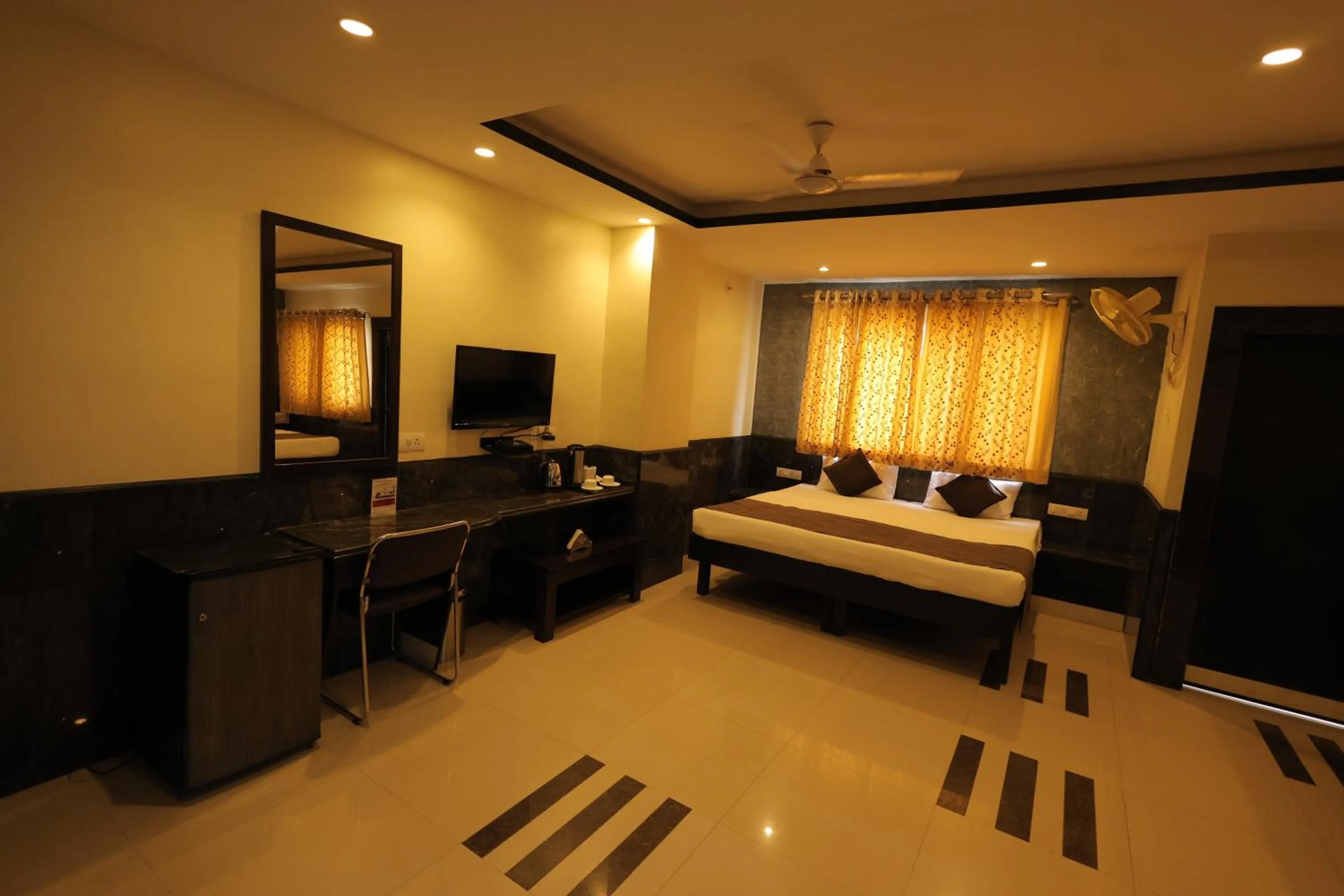 Bed in Nakshatra Hotel