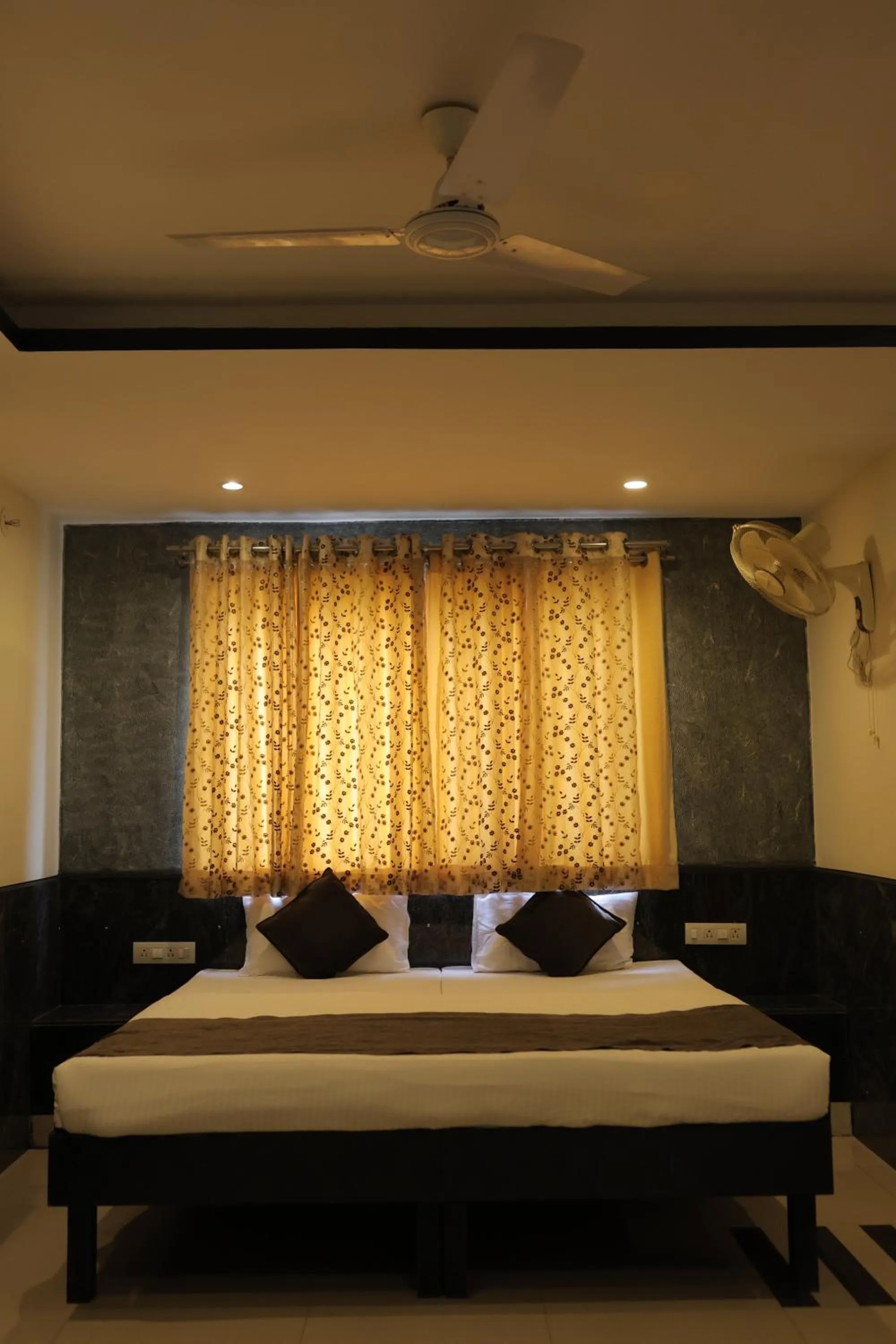 Bed in Nakshatra Hotel