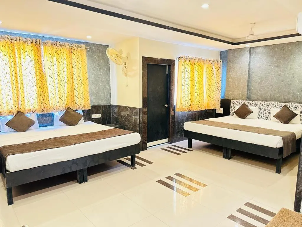 Bed in Nakshatra Hotel