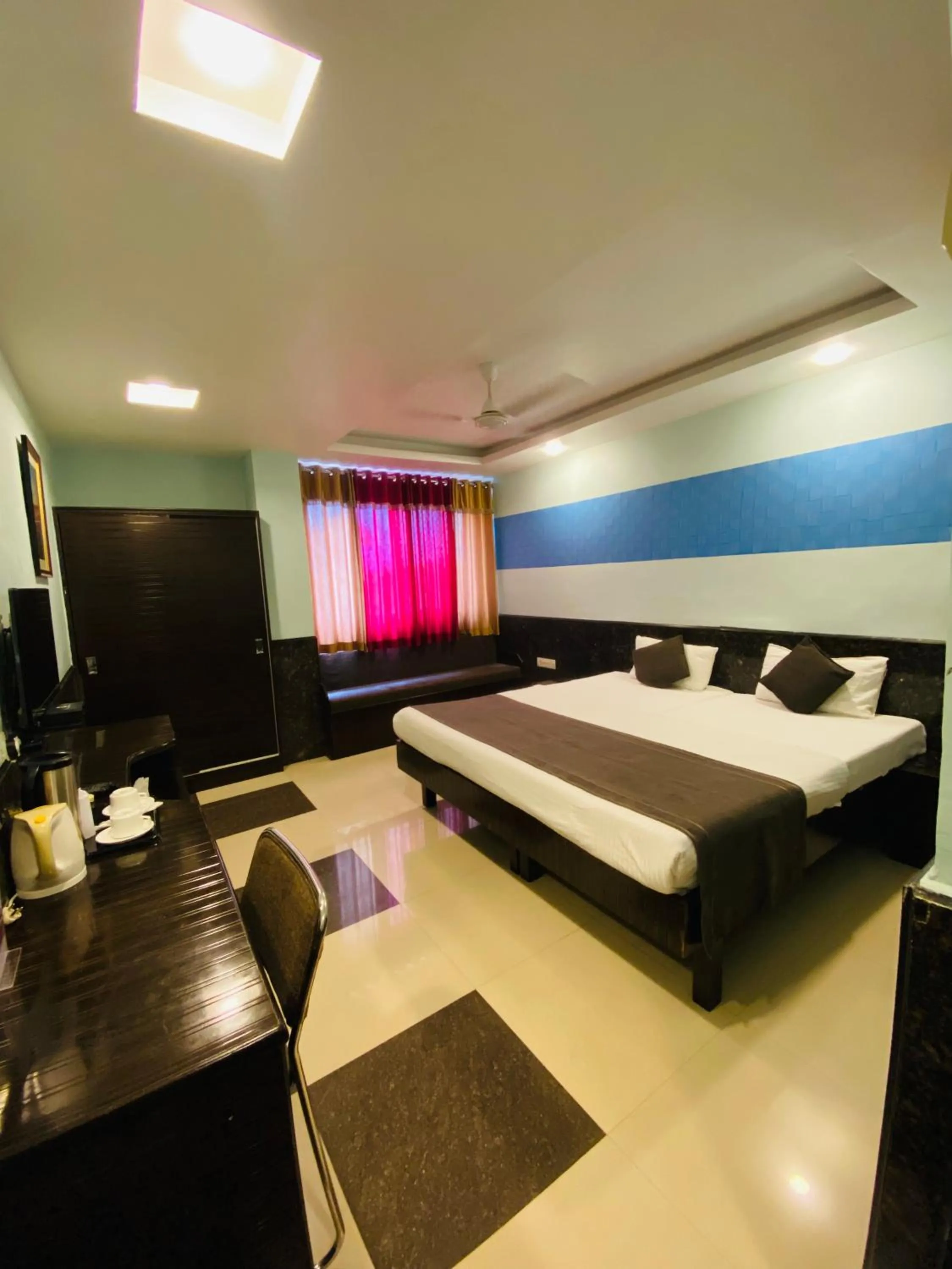 Bed in Nakshatra Hotel