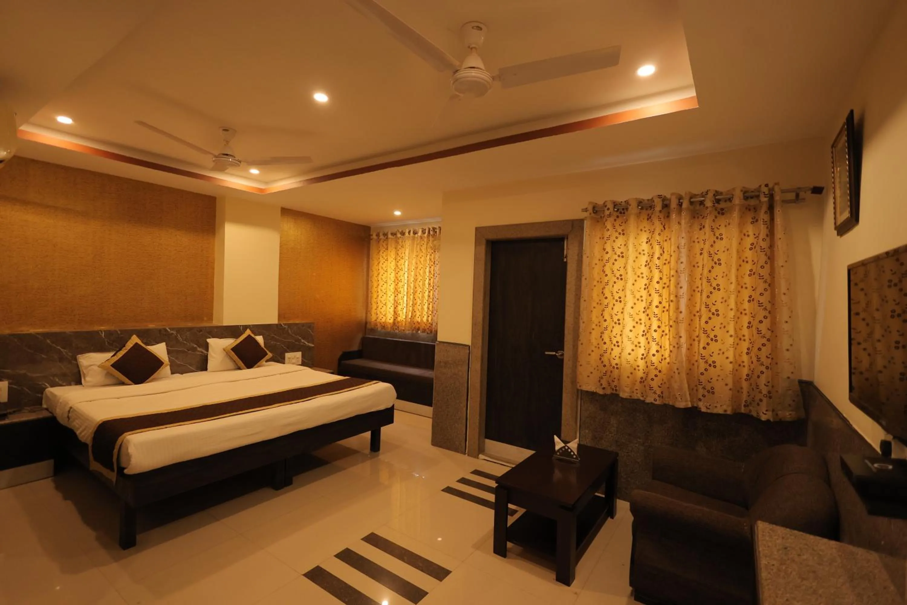 Bed in Nakshatra Hotel