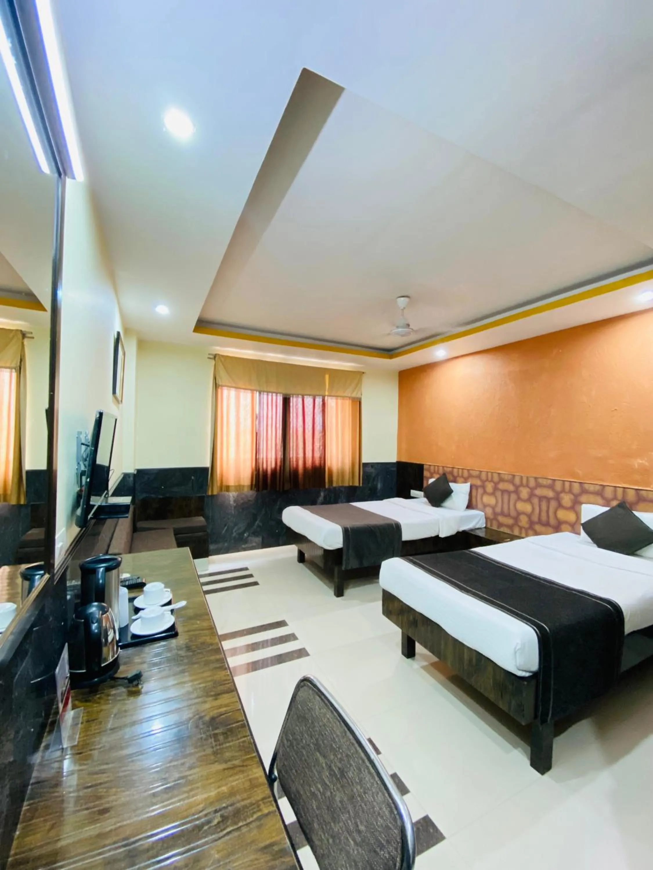 Bed in Nakshatra Hotel