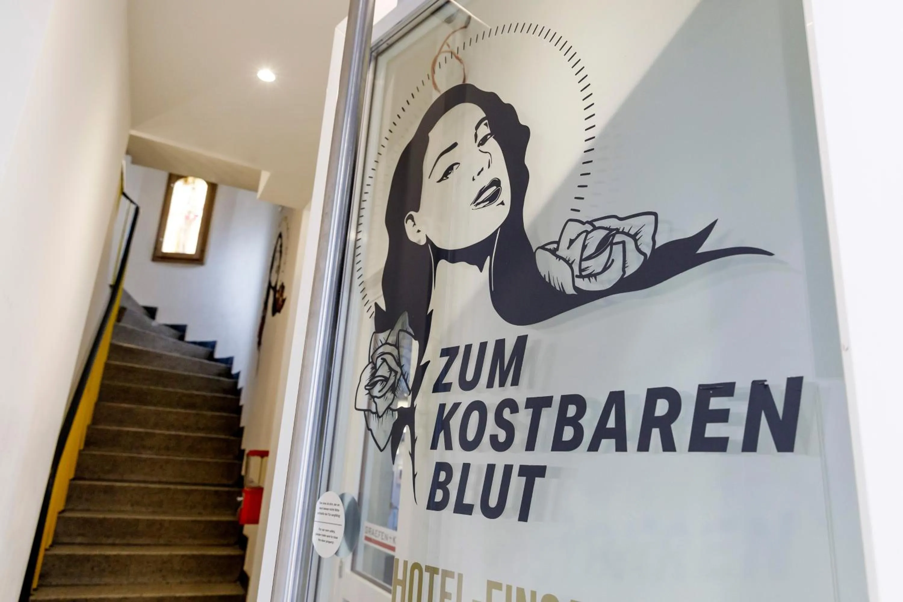 Property logo or sign in KONCEPT HOTEL Zum Kostbaren Blut