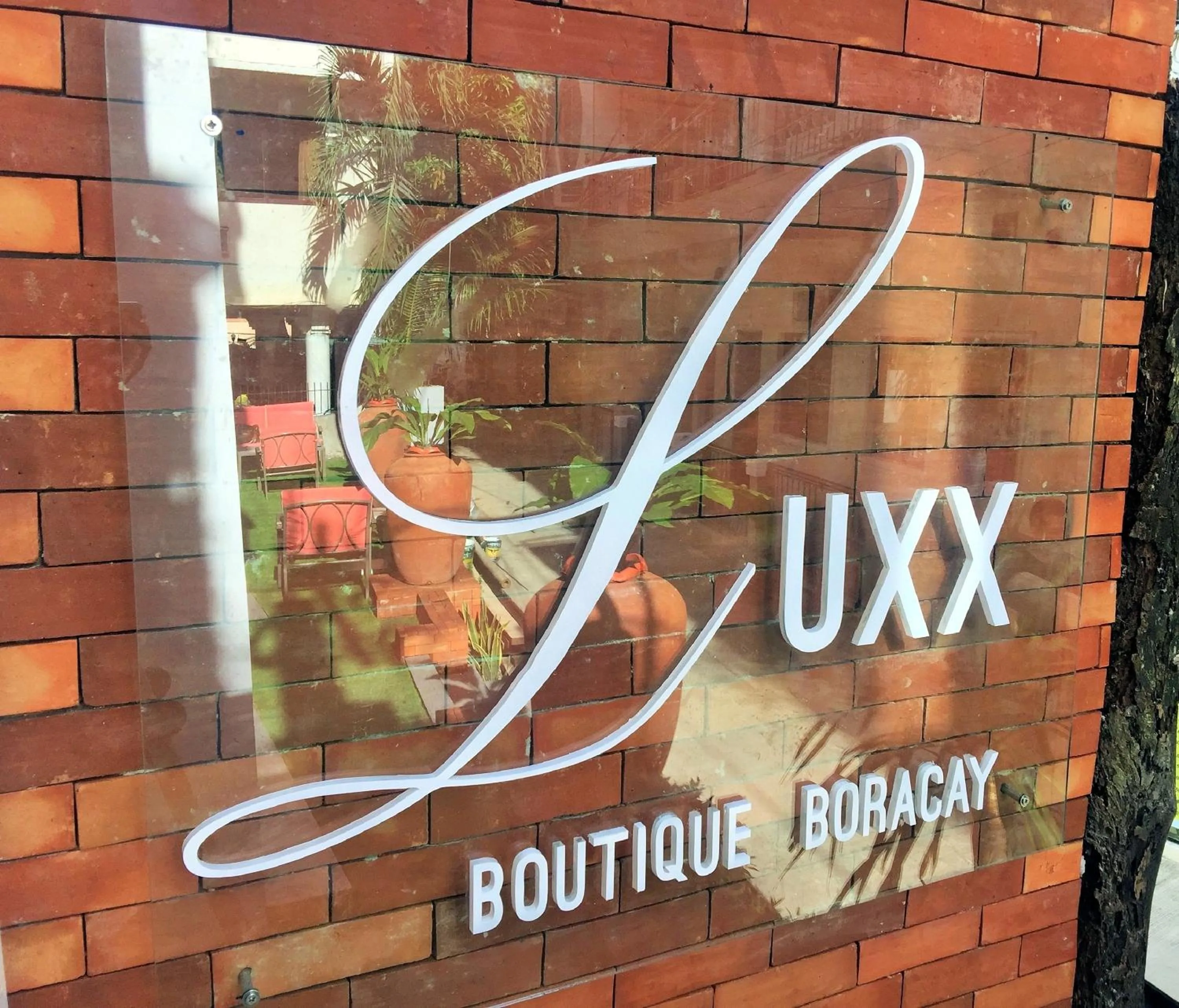 Property logo or sign in Luxx Boutique Boracay
