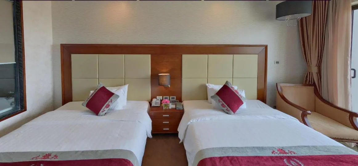 Bed in Le Indochina Hotel