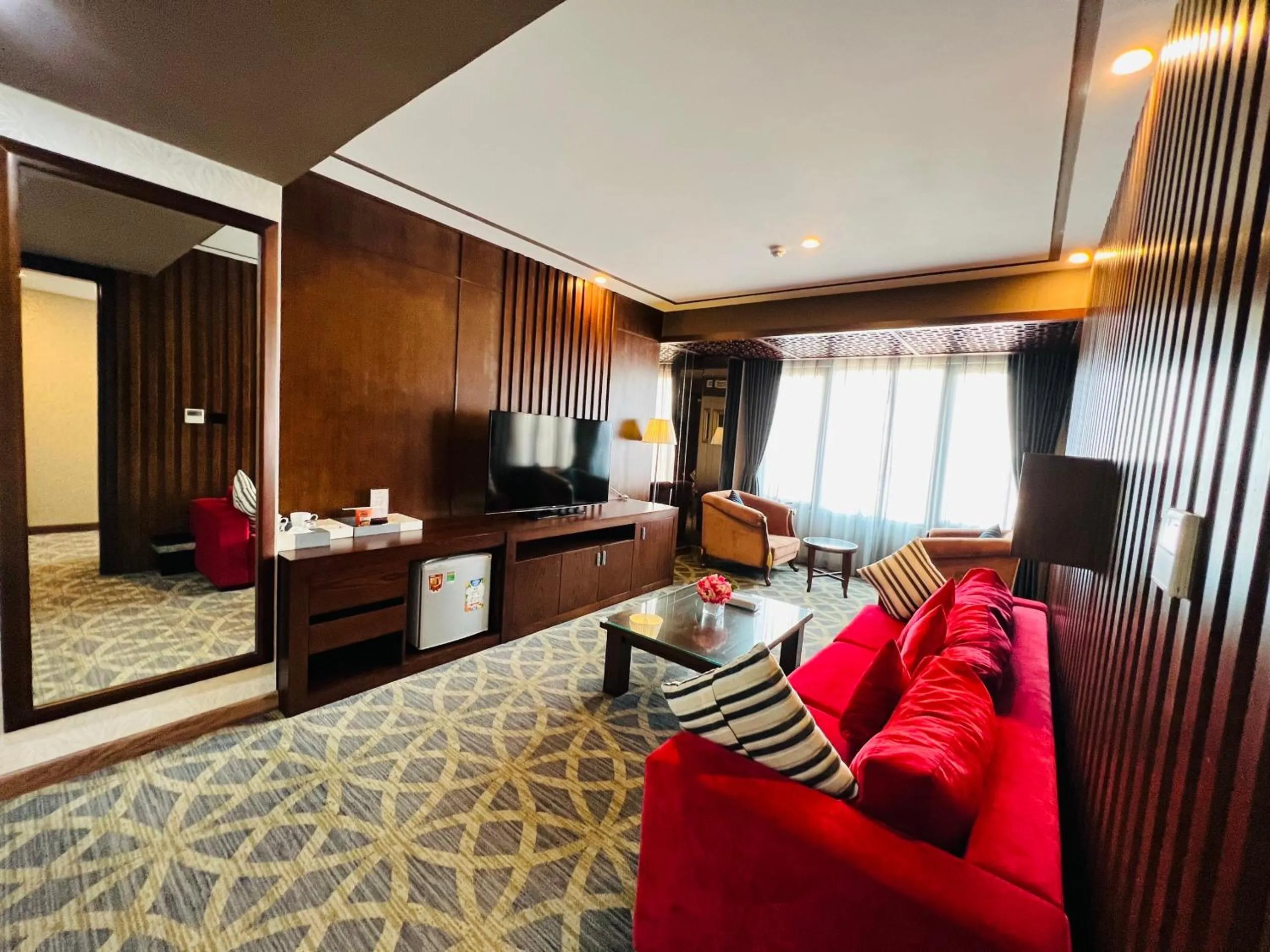 Communal lounge/ TV room in Le Indochina Hotel