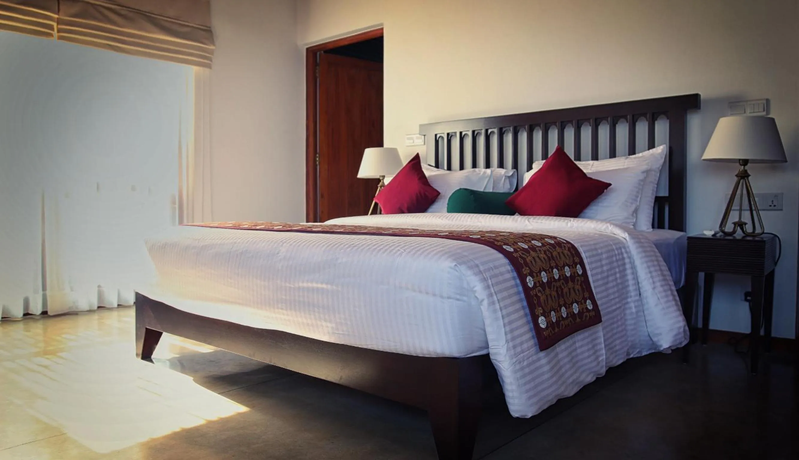 Bed in Kings Pavilion Luxury Hotel