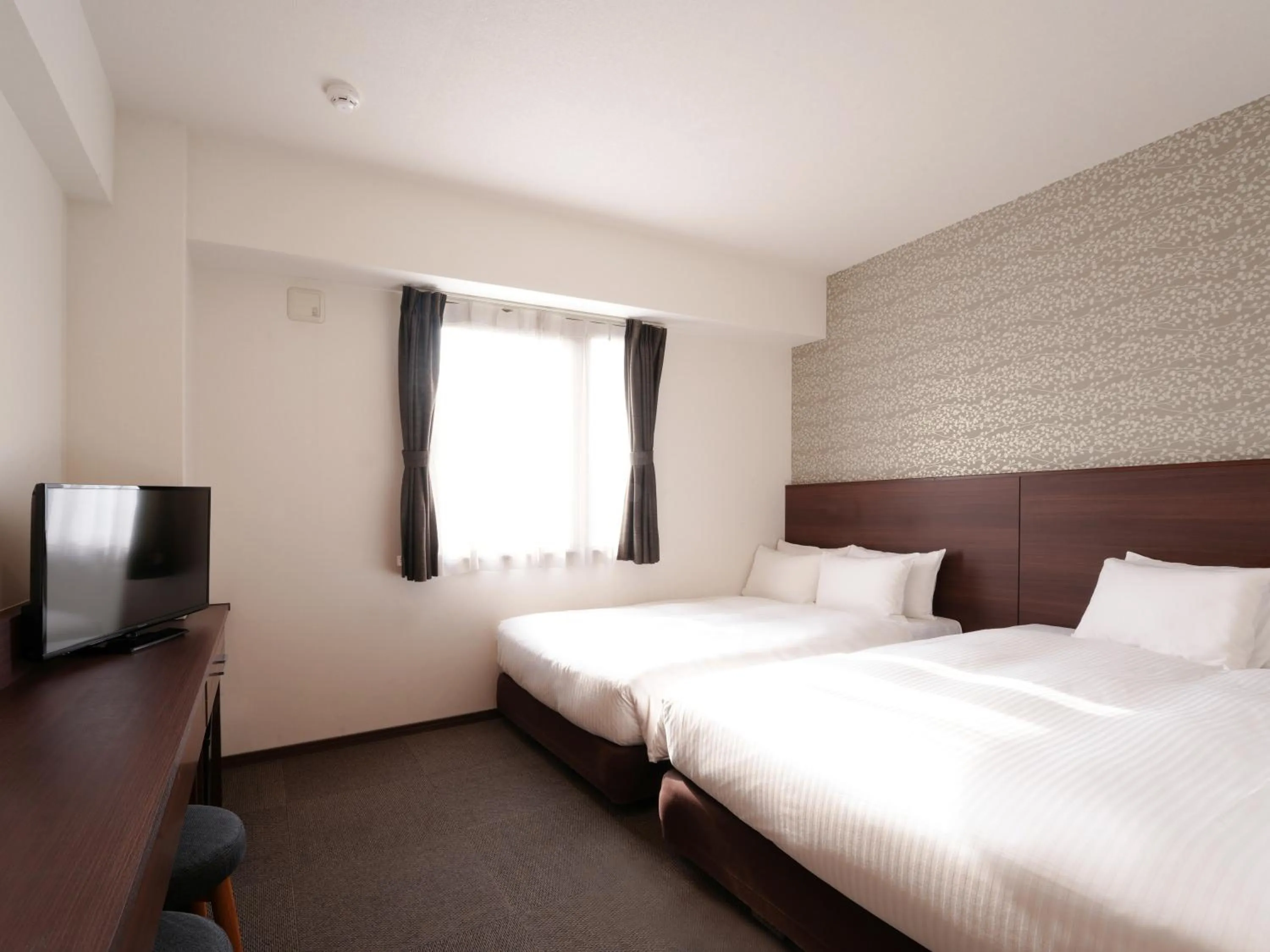 Photo of the whole room, Bed in The BREAKFAST HOTEL Fukuoka Tenjin