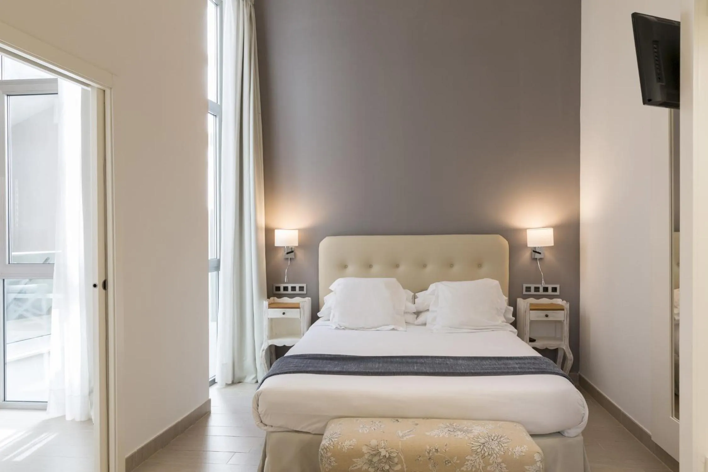 Bed in Welldone Cathedral Suites