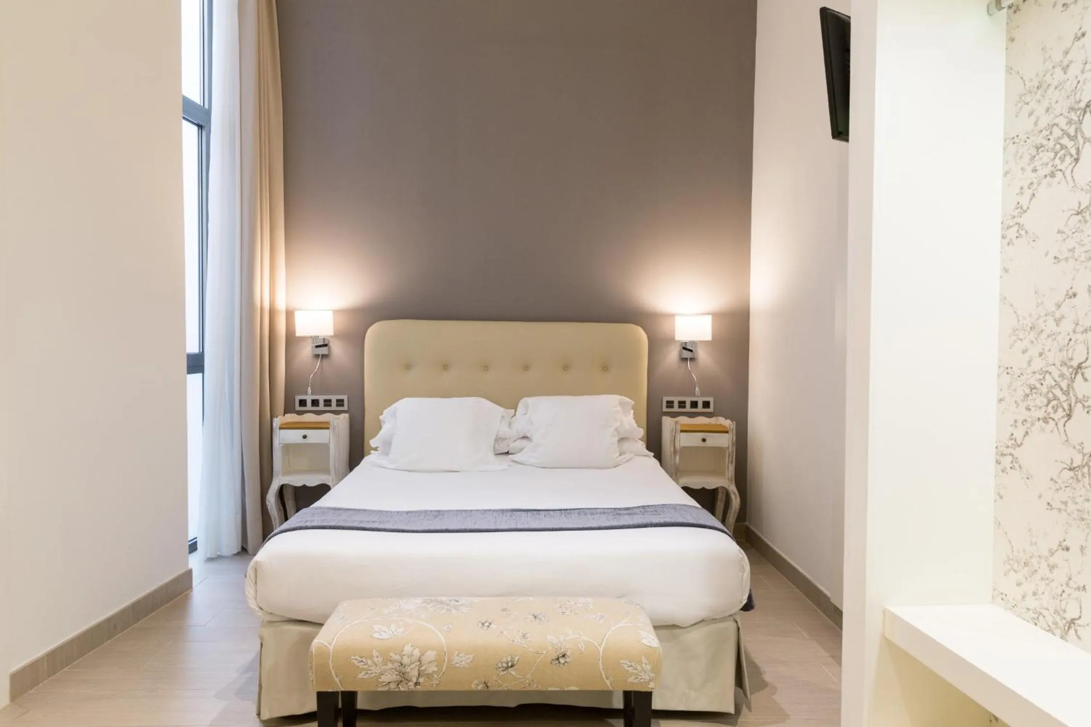 Bed in Welldone Cathedral Suites