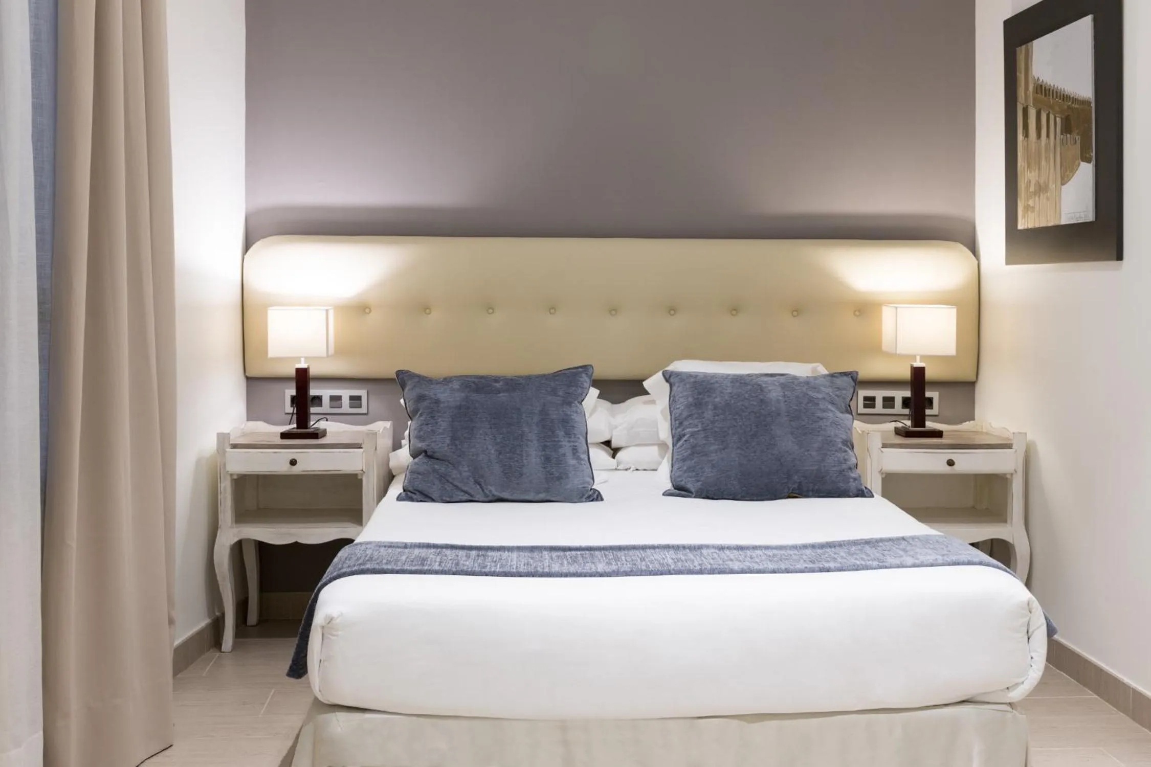 Bed in Welldone Cathedral Suites