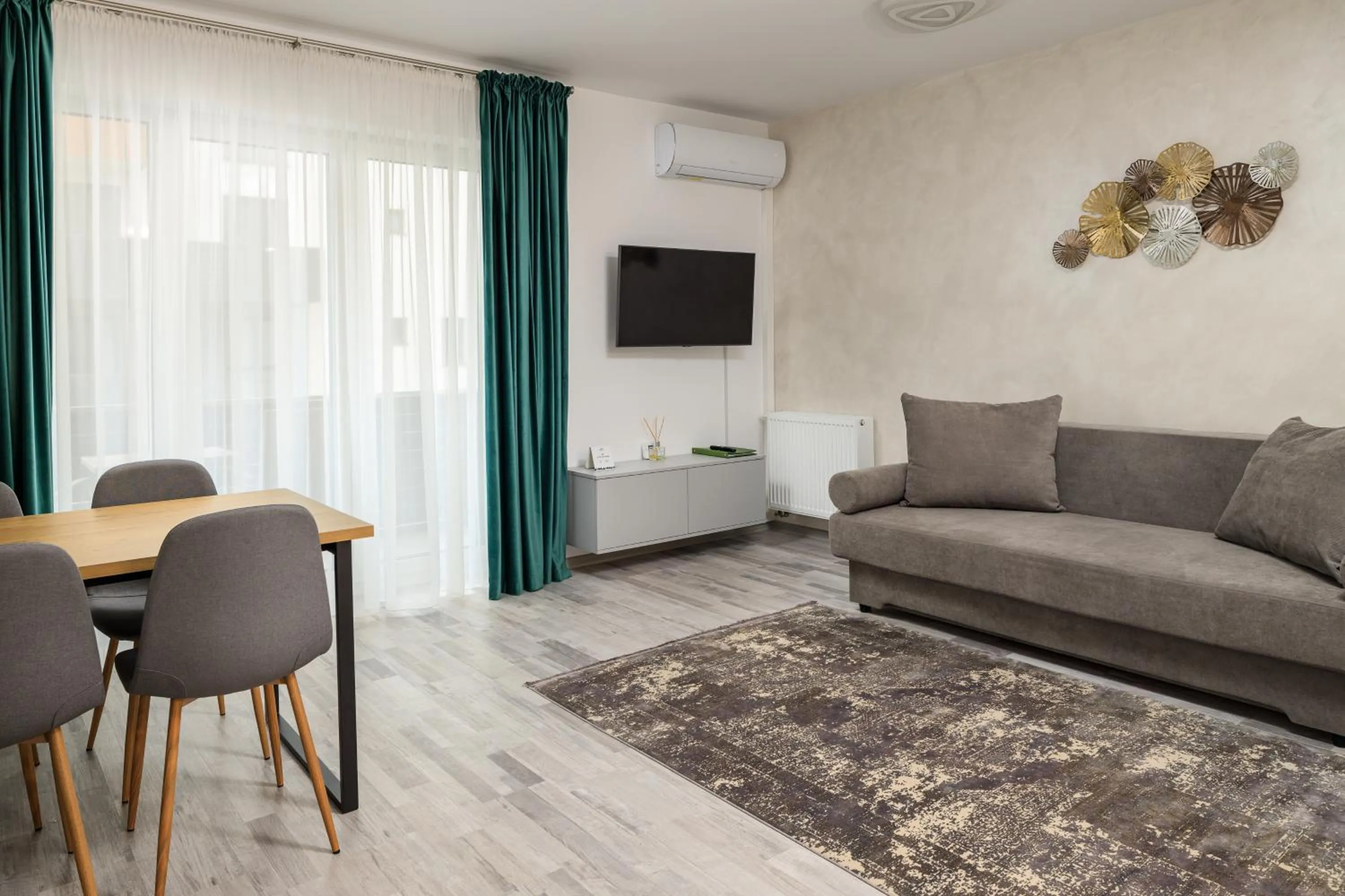 Communal lounge/ TV room in Brasov Holiday Apartments