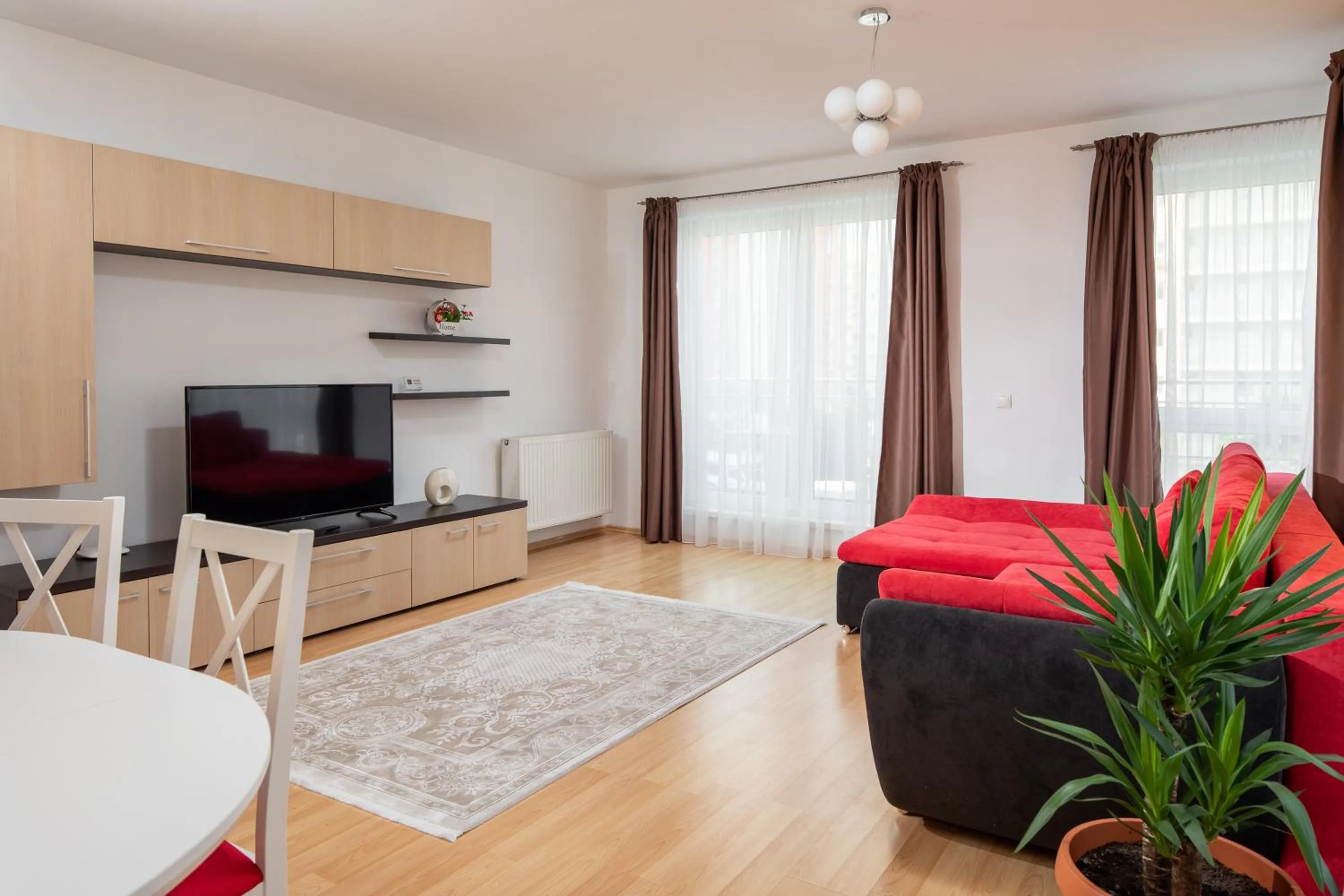 Communal lounge/ TV room in Brasov Holiday Apartments