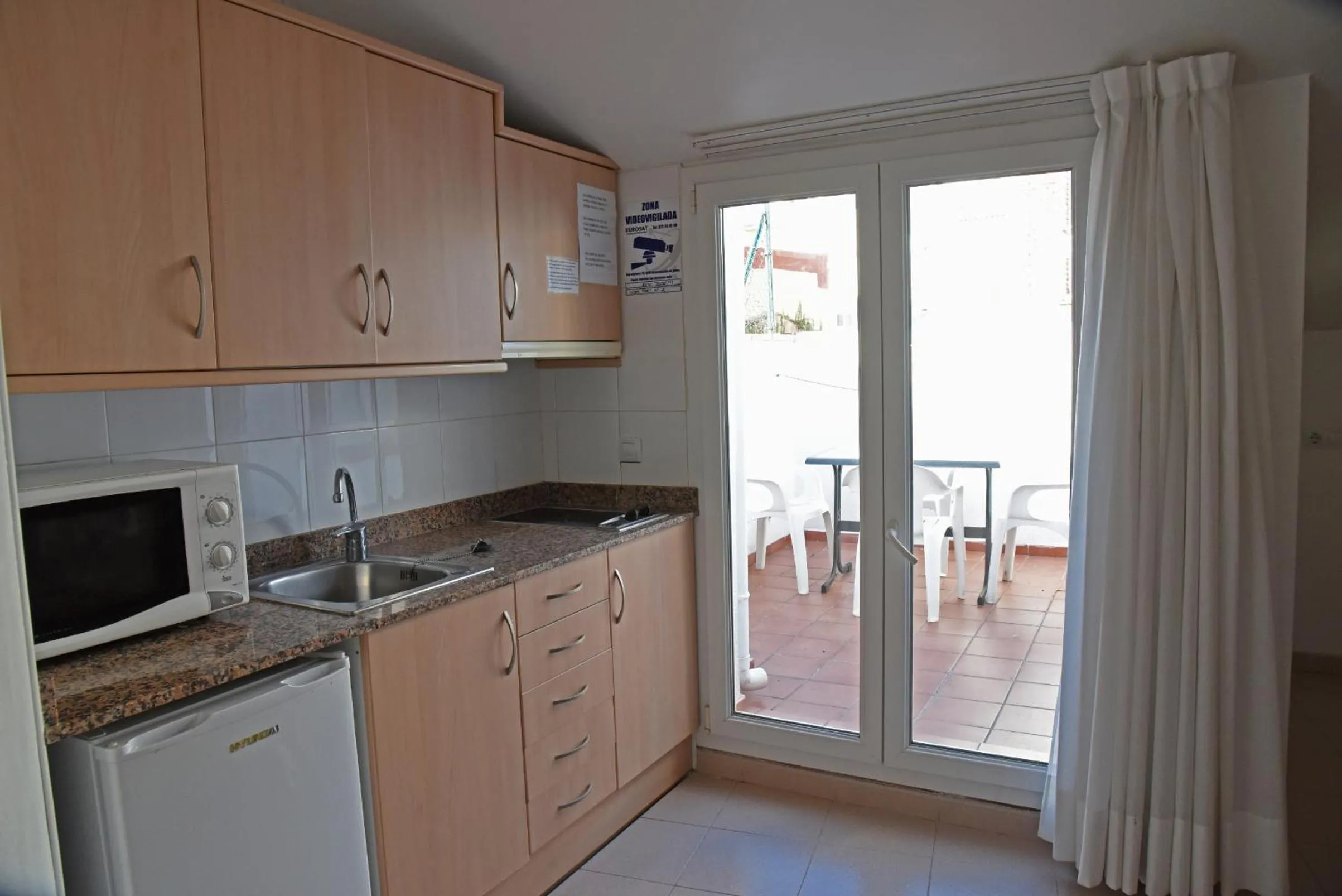 Kitchen or kitchenette in Apartamentos AR Dosjoimi