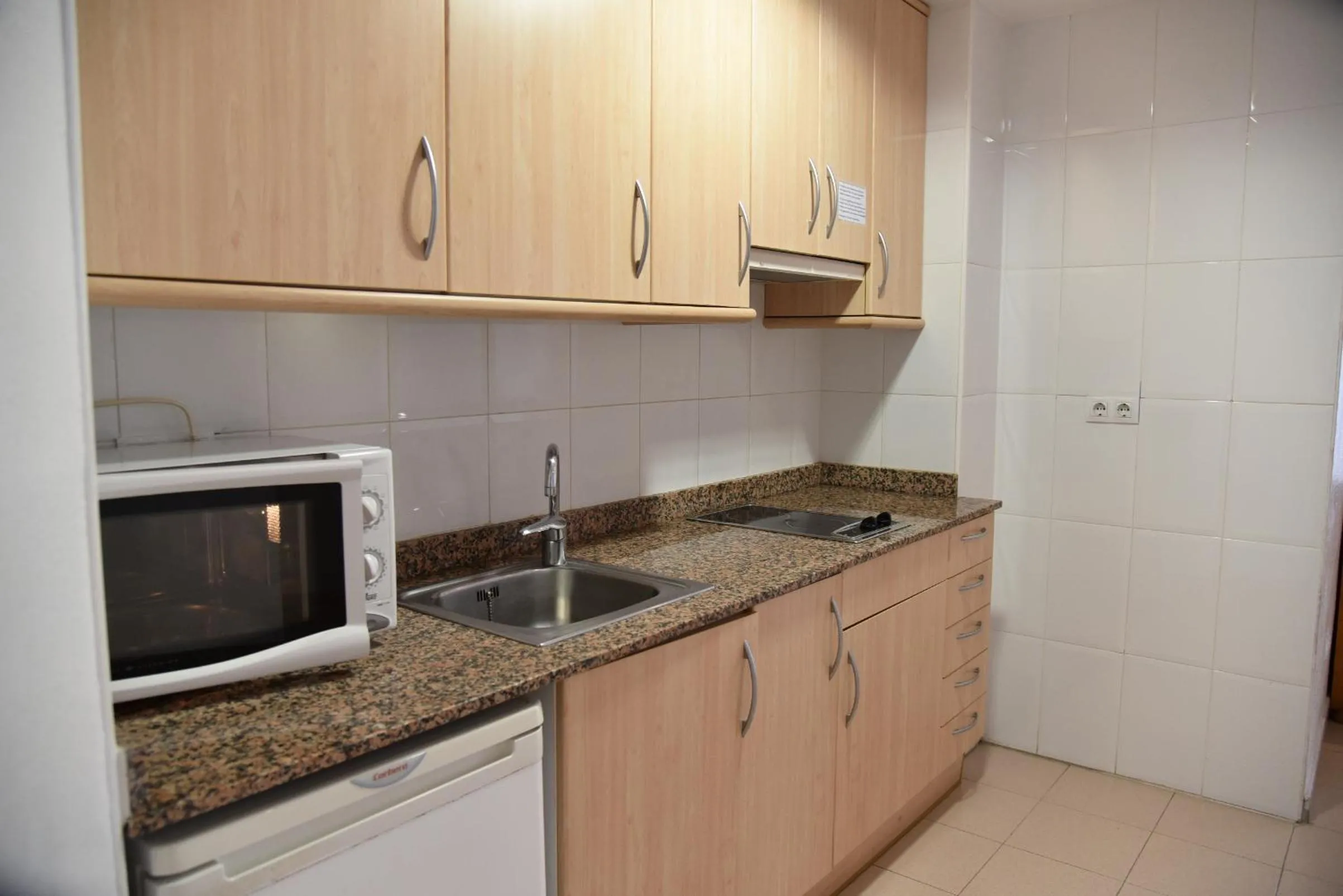 Kitchen or kitchenette in Apartamentos AR Dosjoimi